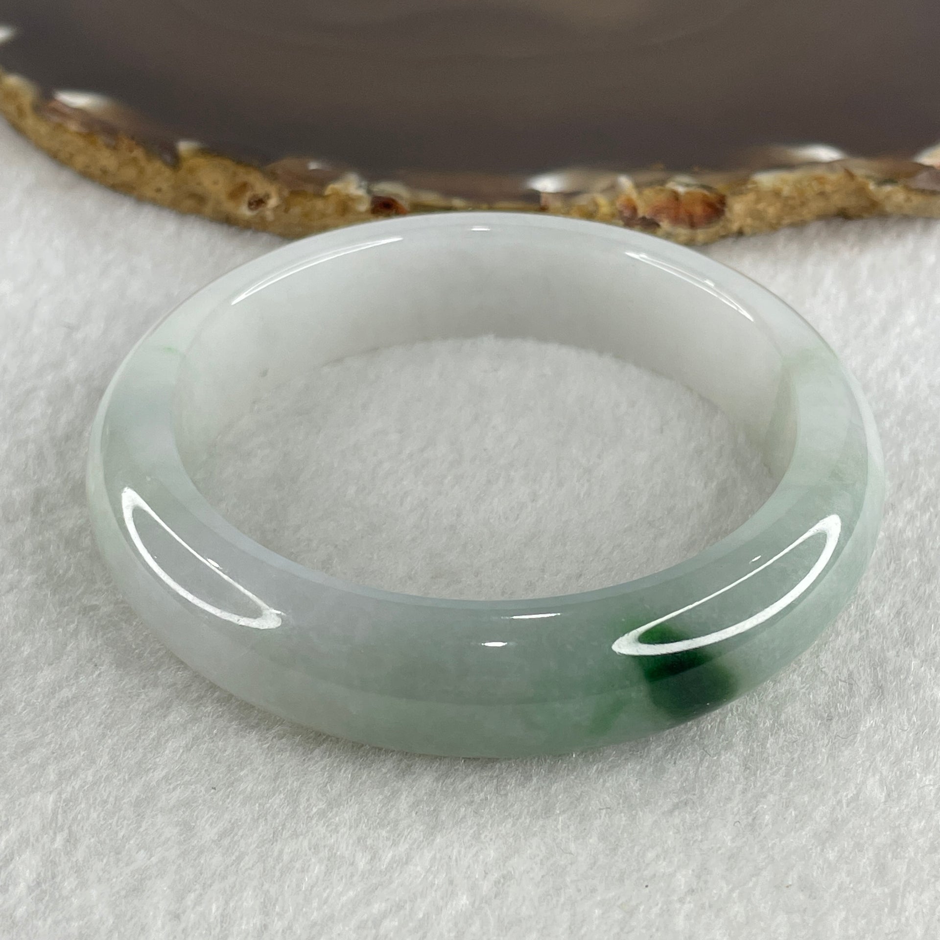 Type A Natural Jelly Light Green with Faint Lavender with Spicy Green Spot Jadeite Bangle 70.15g Inner Diameter 57.8mm 14.3 by 9.6mm (Close to Perfect) - Huangs Jadeite and Jewelry Pte Ltd