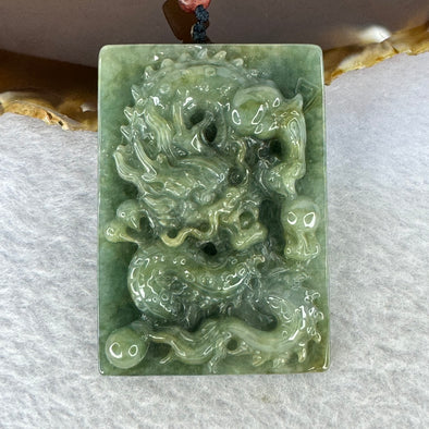 Type A Oily Green with Brown Patches Jadeite Dragon Pendent 71.74g 59.0. by 41.2 by 12.4 mm - Huangs Jadeite and Jewelry Pte Ltd