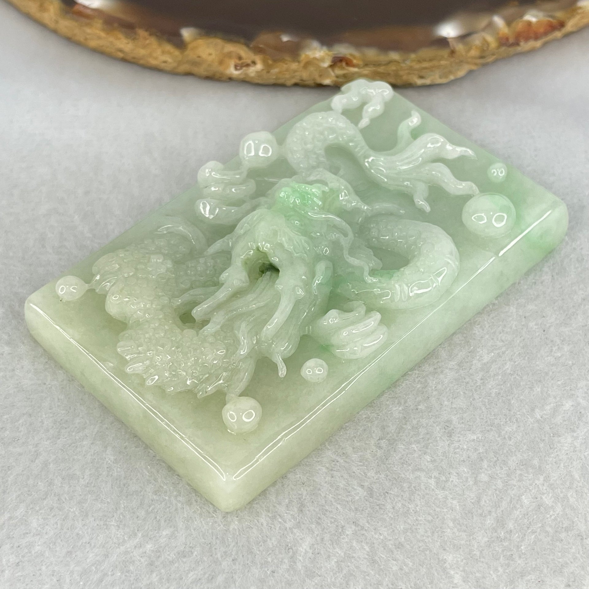 Type A Light Apple Green Jadeite Dragon Pendant 87.90g 69.4 by 44.2 by 14.2mm - Huangs Jadeite and Jewelry Pte Ltd
