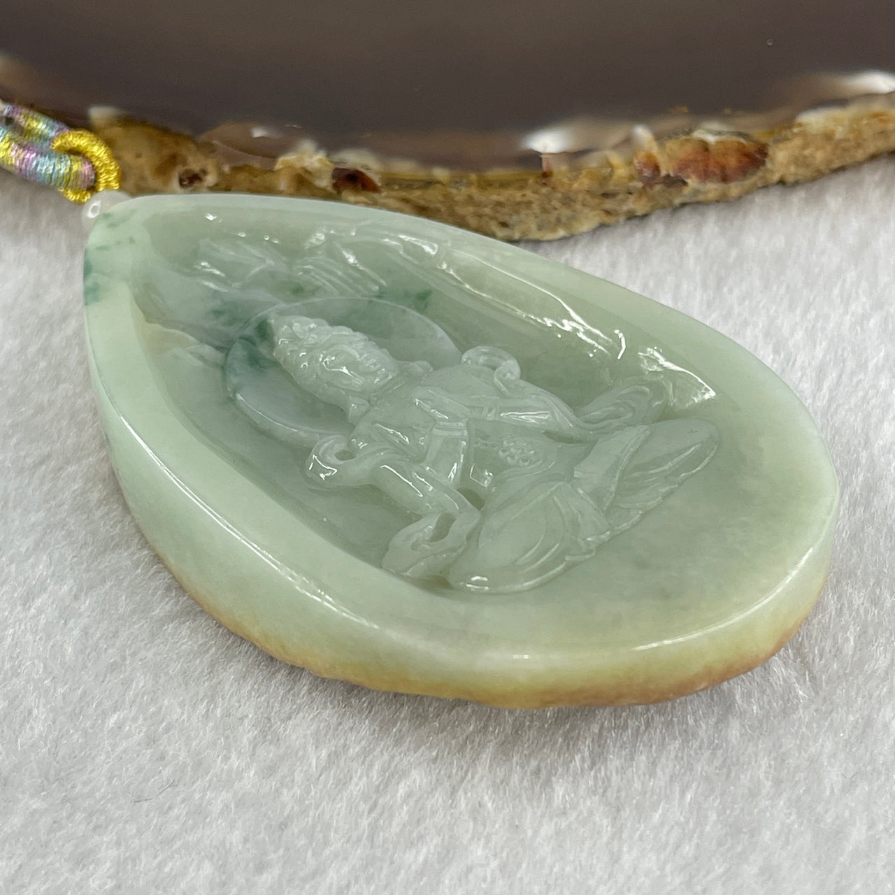 Natural Type A Light Green with Yellow Skin and Blueish Green Piao Hua Jadeite Guan Yin Pendant 77.96g 73.4 by 45.2 by 12.9mm