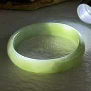 Type A Light Apple Green Jadeite Oval Bangle 33.35g Internal Diameter 52.3mm 12.2 by 6.5mm (Very Slight Fine Internal Lines) - Huangs Jadeite and Jewelry Pte Ltd