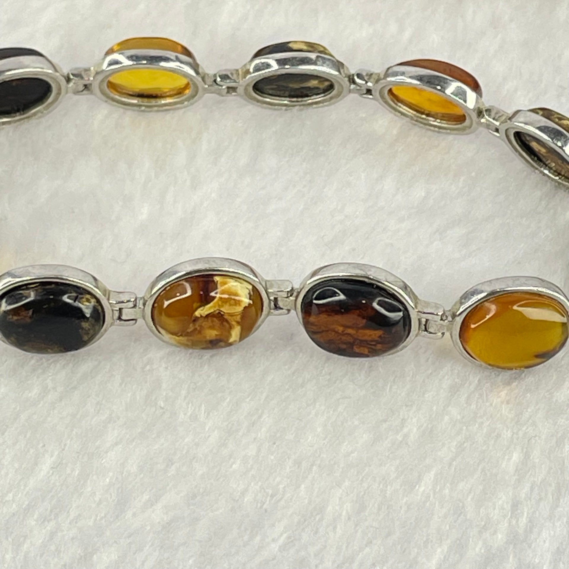 Natural Mixed Color Amber Beads in Sliver Bracelet 天然抚顺多宝手链 11.11g 16.5cm 10.0 by 7.9 by 4.0mm 11pcs - Huangs Jadeite and Jewelry Pte Ltd