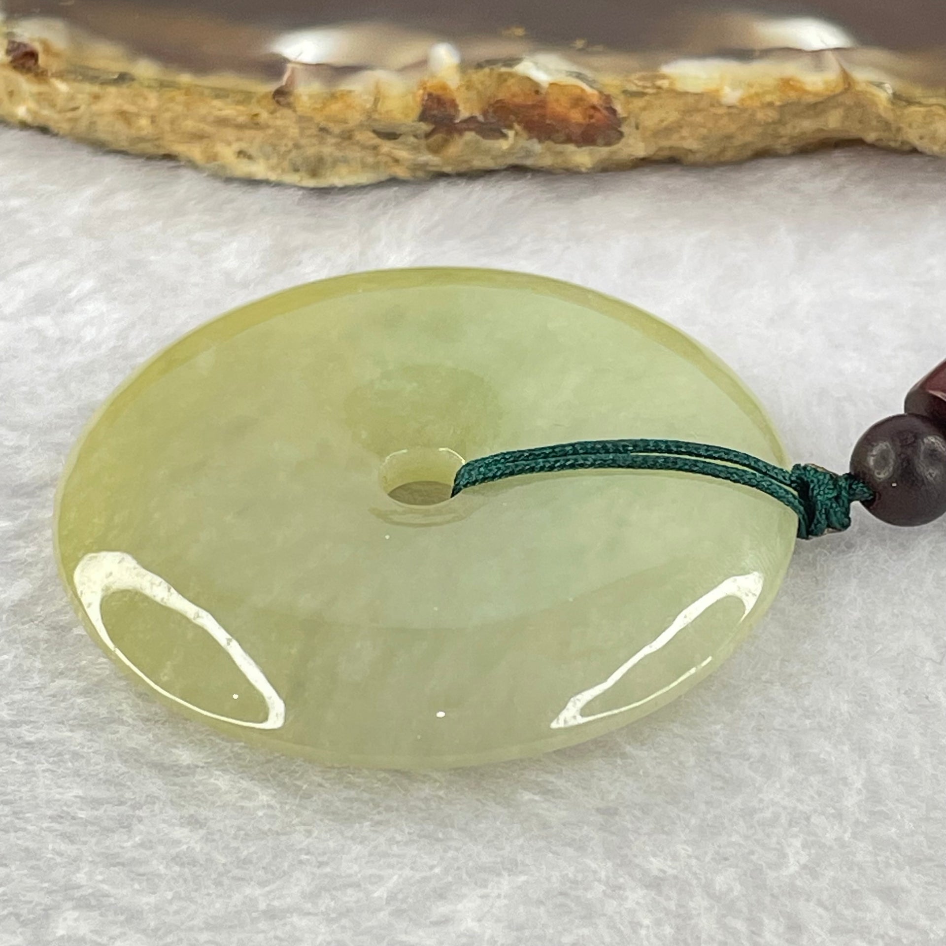 Type A Yellowish Green Jadeite Ping An Kou Donut Pendent 24.41g 43.0 by 7.1mm - Huangs Jadeite and Jewelry Pte Ltd