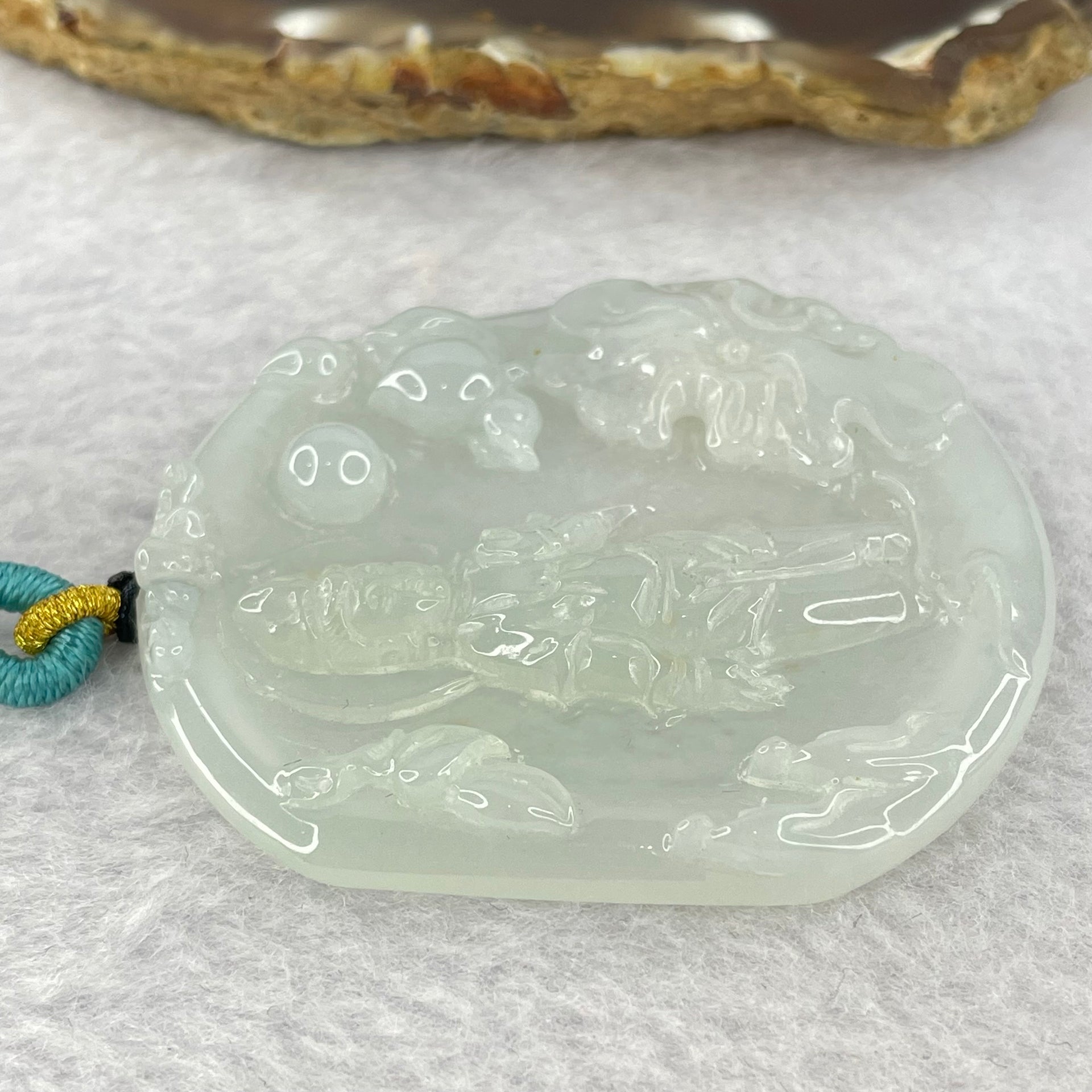 Type A Light Green to white Jadeite Guan Yin Pendent 32.29g 57.8 by 52.6 by 6.6mm - Huangs Jadeite and Jewelry Pte Ltd