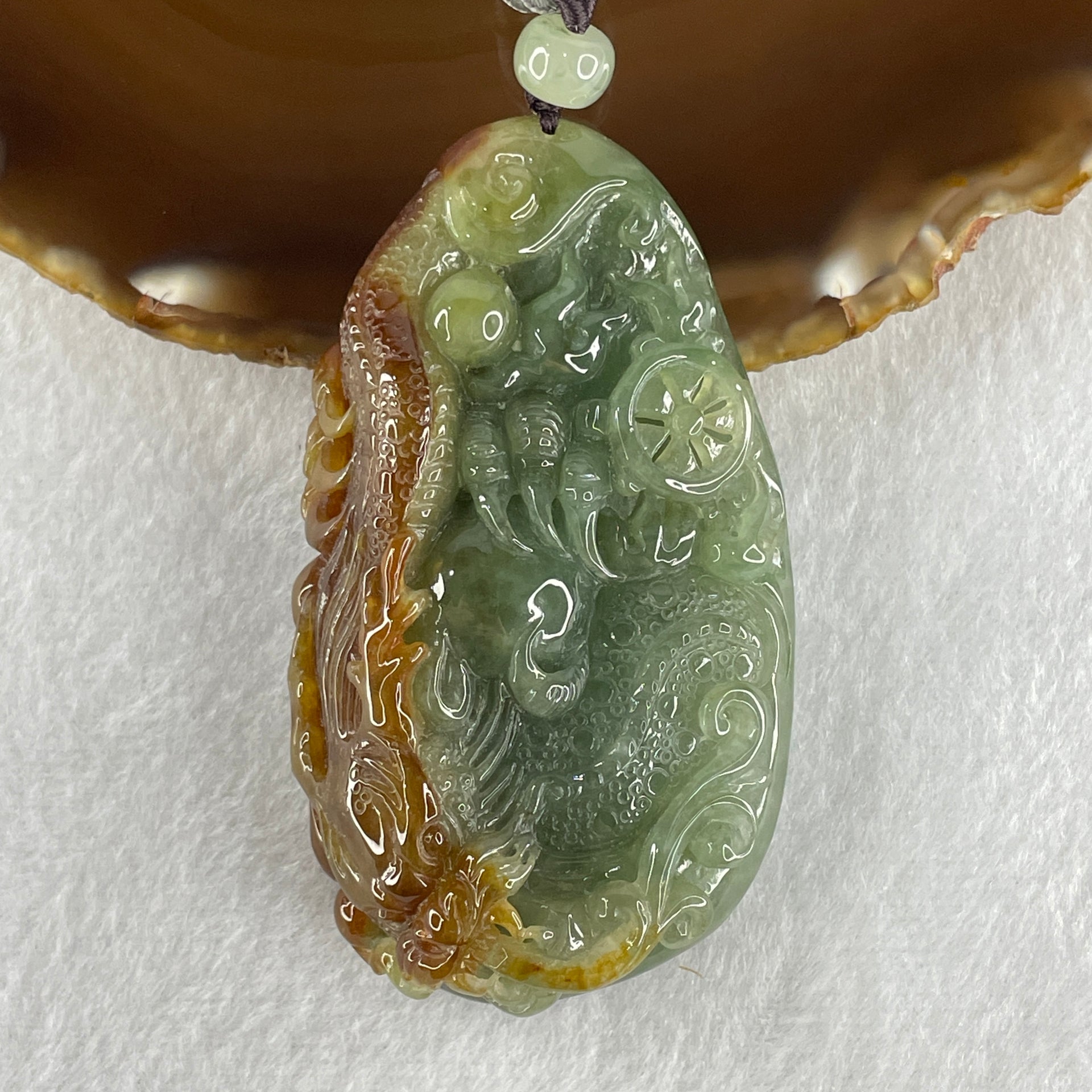 Grand Master Type A Light Green with Yellow Patches Jadeite Dragon Double Side Pendant 100.73g 35.0 by 43.3 by 20.9mm - Huangs Jadeite and Jewelry Pte Ltd