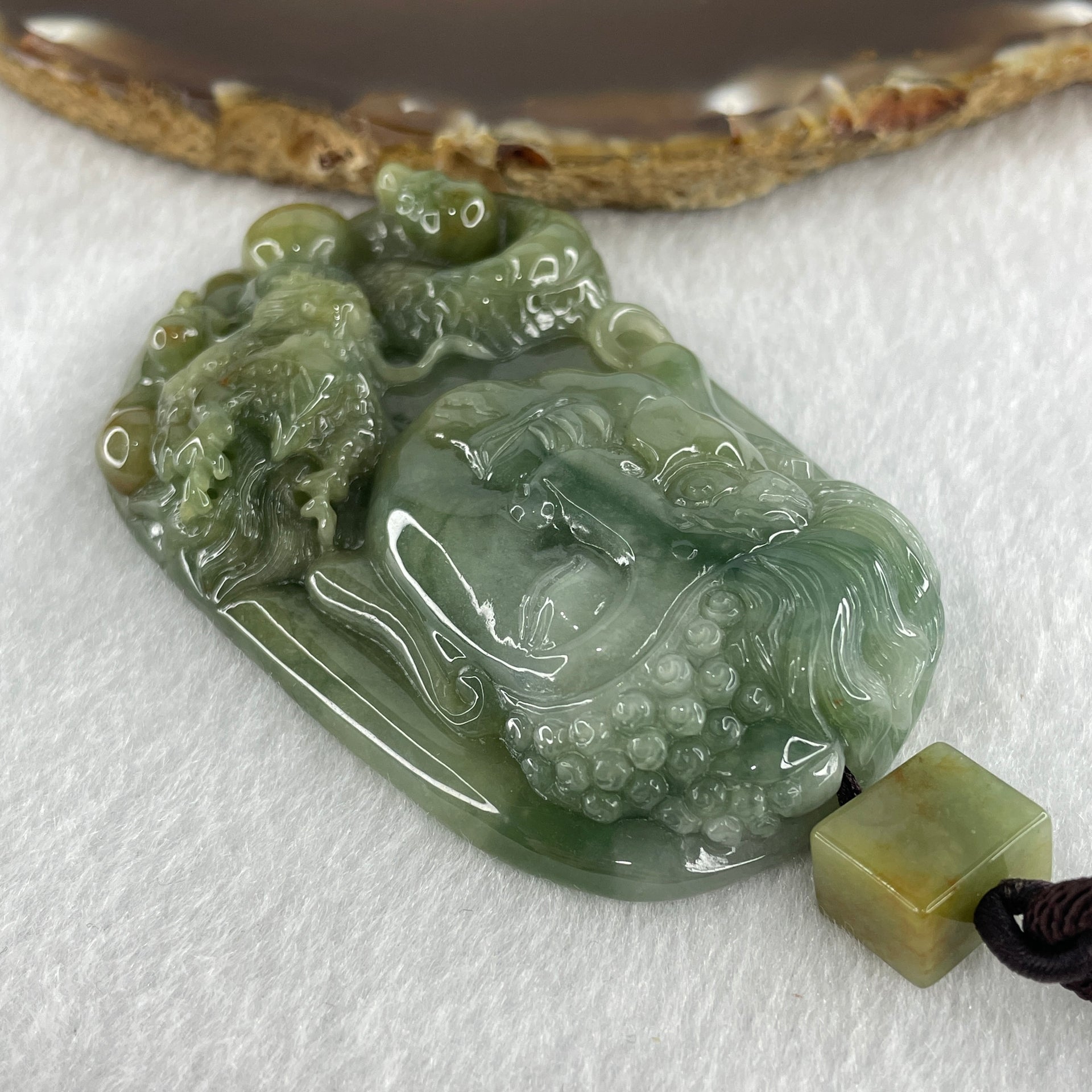 Natural Type A Blueish Green with Light Brown Jadeite Good Vs Evil (Buddha Vs Devil) with Dragon 80.23g 68.0 by 43.7 by 12.3mm - Huangs Jadeite and Jewelry Pte Ltd