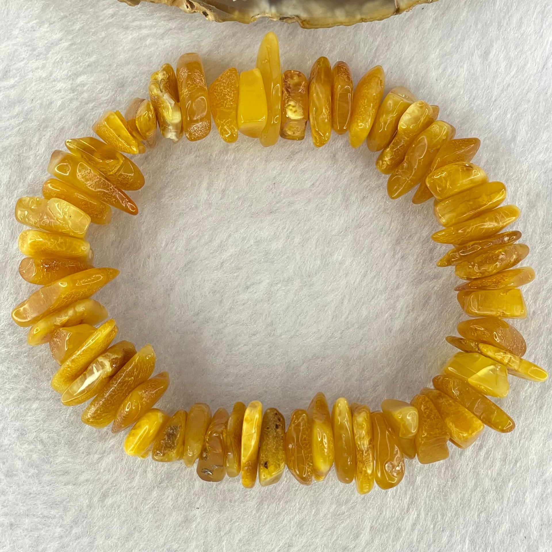 Natural Beeswax Raw Stone Irregular Beads Bracelet 天然蜜蜂蜡原石手链 22.59g 18.5cm 21.6 by 12.6 by 4.7mm, 13.1 by 11.7 by 4.8mm 54pcs - Huangs Jadeite and Jewelry Pte Ltd