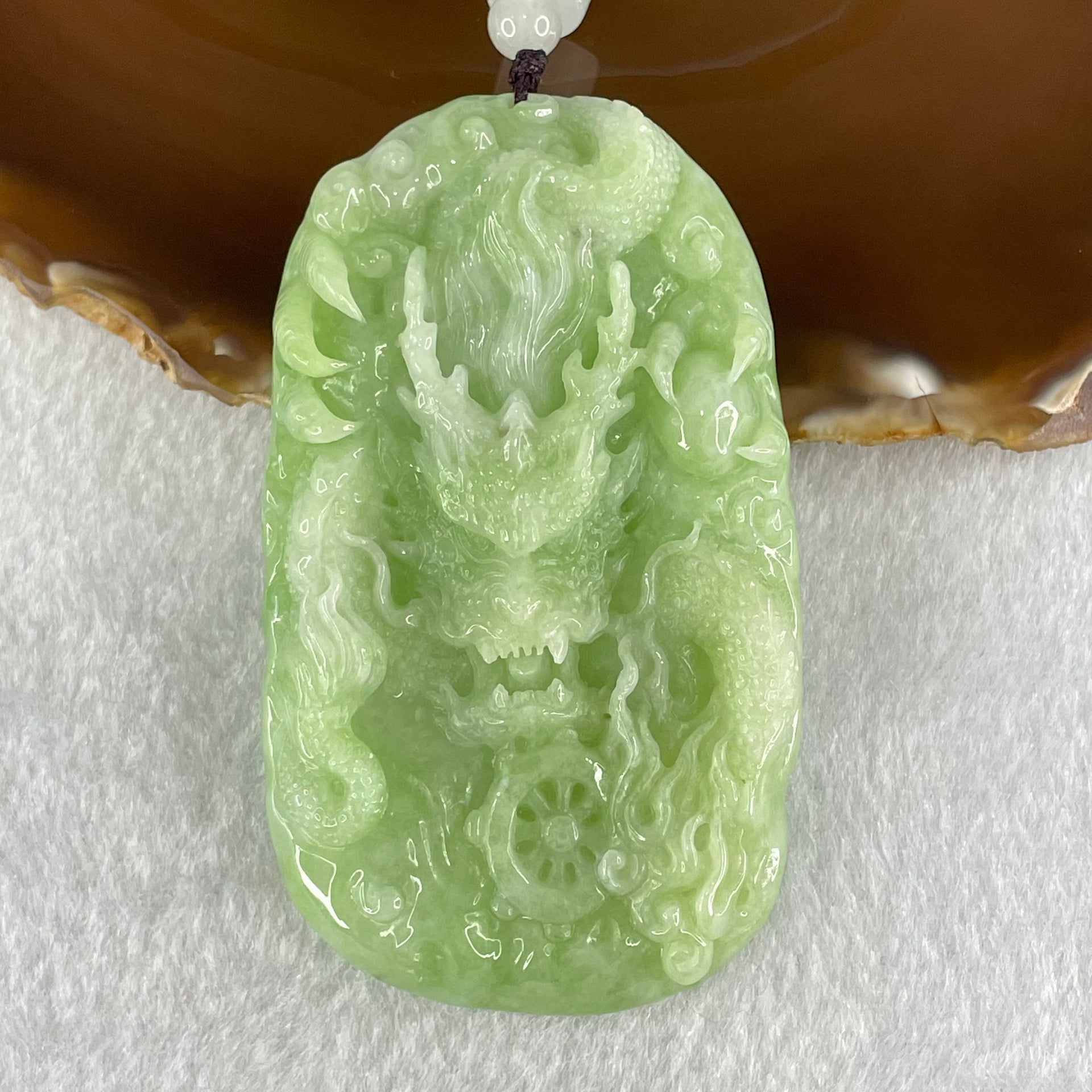 Type A Apple Green Jadeite Double Sided Fire Dragon Pendant 80.29g 75.3 by 44.4 by 13.2mm - Huangs Jadeite and Jewelry Pte Ltd
