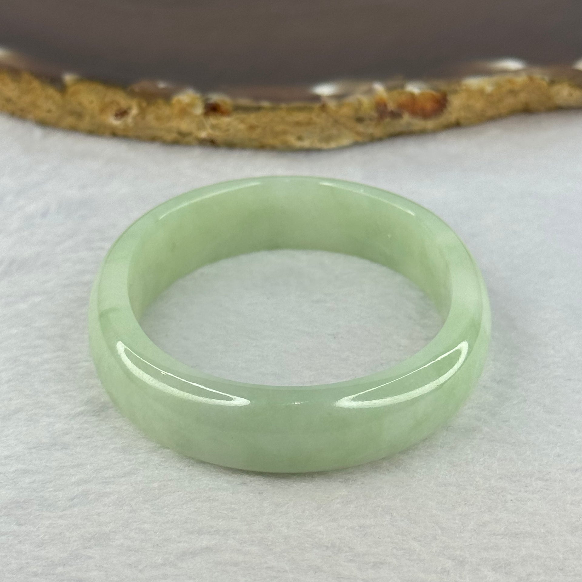Type A Light Apple Green Jadeite Oval Bangle 33.35g Internal Diameter 52.3mm 12.2 by 6.5mm (Very Slight Fine Internal Lines) - Huangs Jadeite and Jewelry Pte Ltd