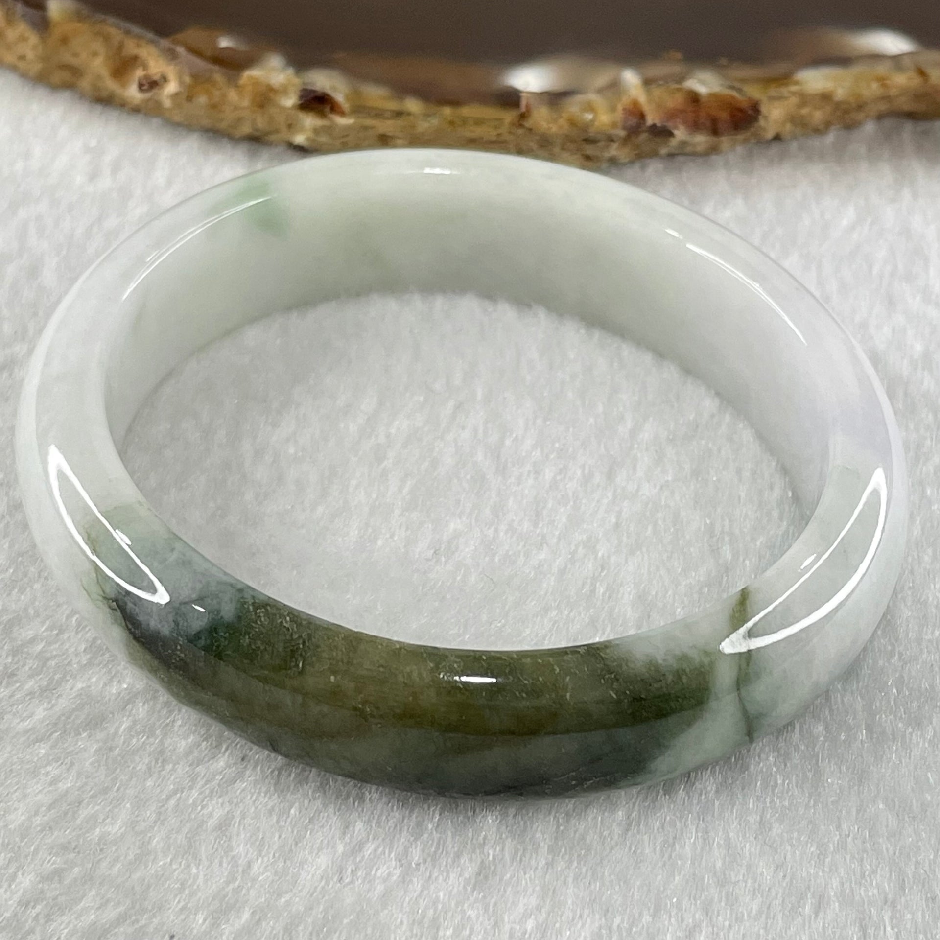 Type A Faint Lavender with Moss Green Patches Jadeite Oval Bangle 43.11g Internal Diameter 53.3mm 13.5 by 6.9mm (Slight External Roughs and Internal Lines) - Huangs Jadeite and Jewelry Pte Ltd
