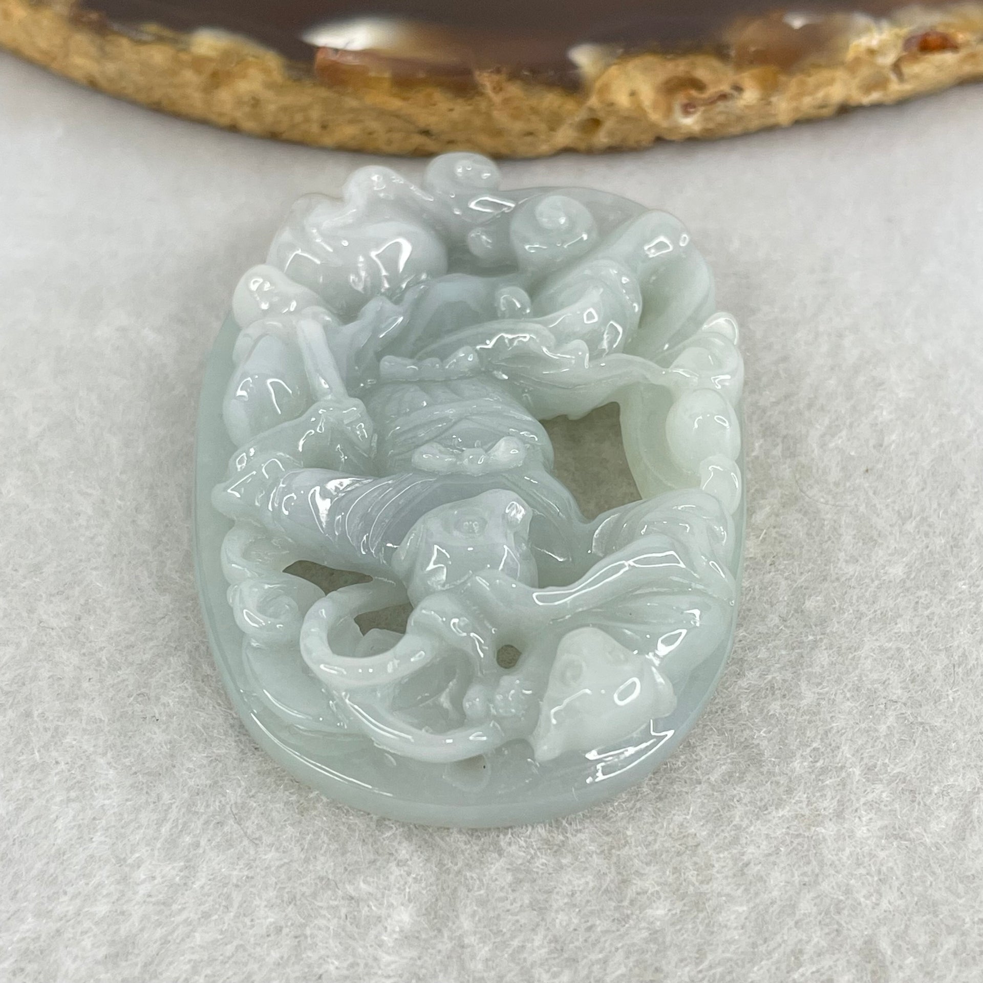 Type A Light Sky Blue Jadeite Sun Wu Kong Pendant 27.49g 52.8 by 37.1 by 11.0mm - Huangs Jadeite and Jewelry Pte Ltd