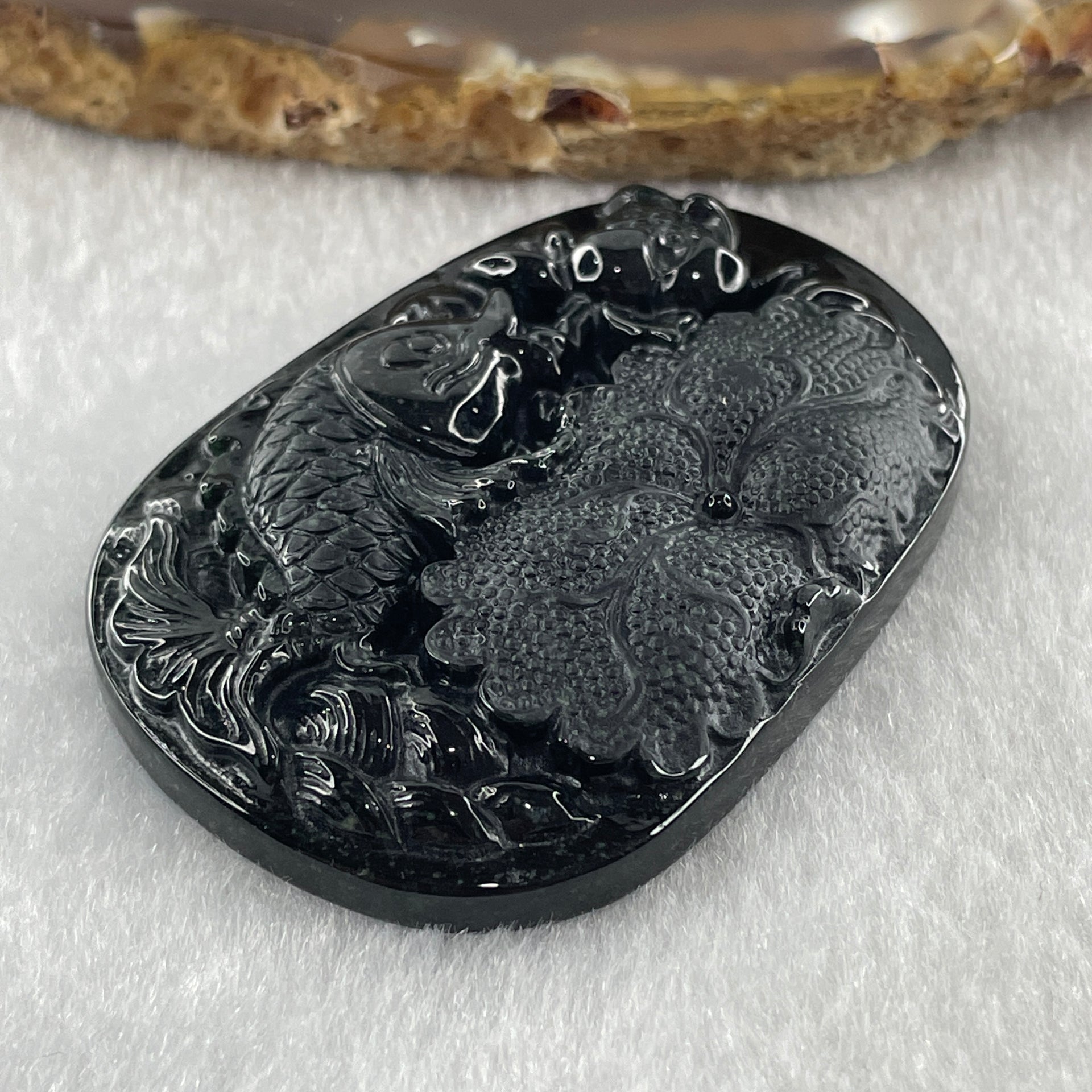 Type A Opaque to Partial Translucent Black Omphacite Jadeite Fish with Lotus Flower and Leaf Pendant 24.60g 51.1 by 35.9 by 8.8mm - Huangs Jadeite and Jewelry Pte Ltd