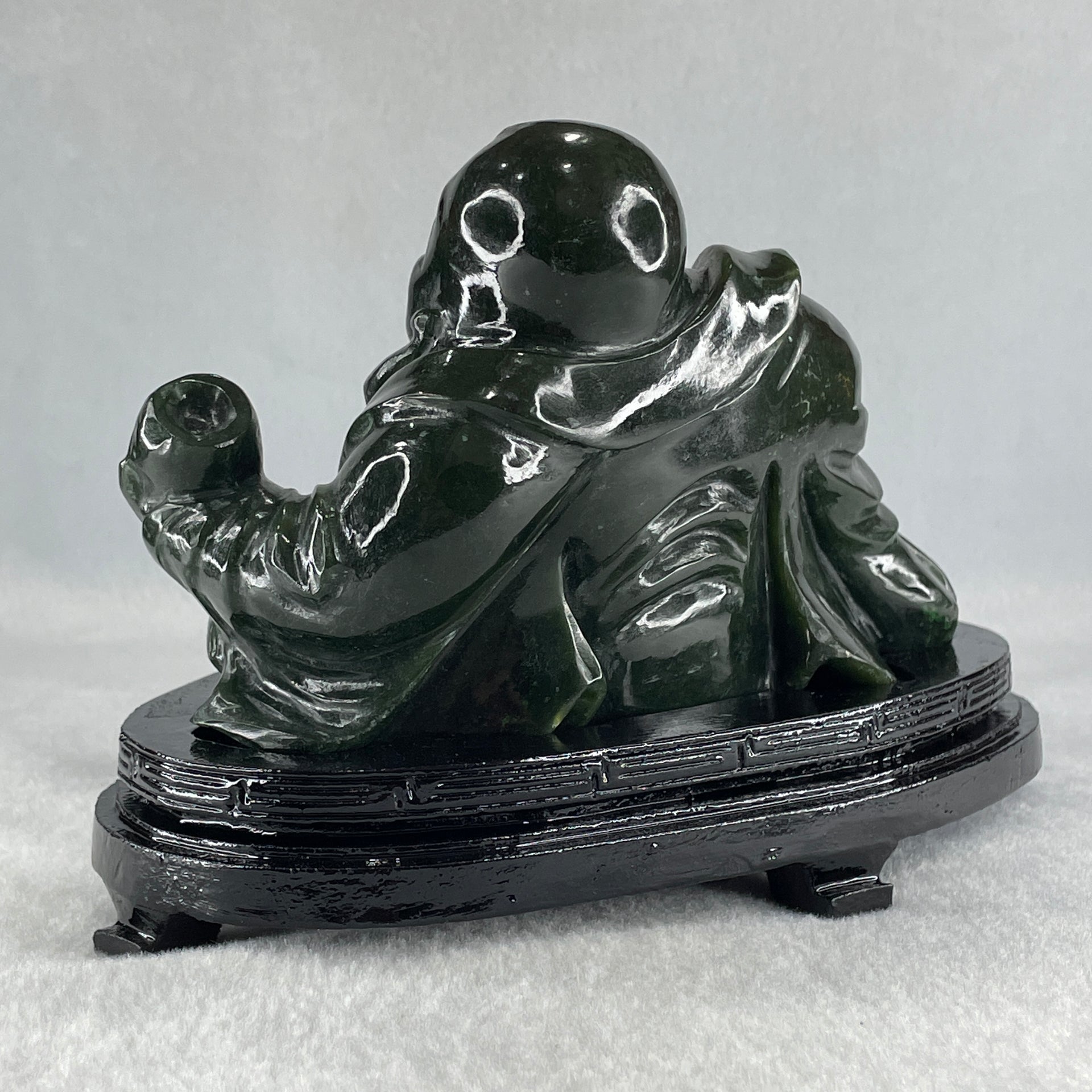 Natural Dark Green Serpentine Laughing Milo Buddha with Wealth Pot with Wooden Stand Display 1,656.6g 190.0 by 133.0 by 127.0mm - Huangs Jadeite and Jewelry Pte Ltd