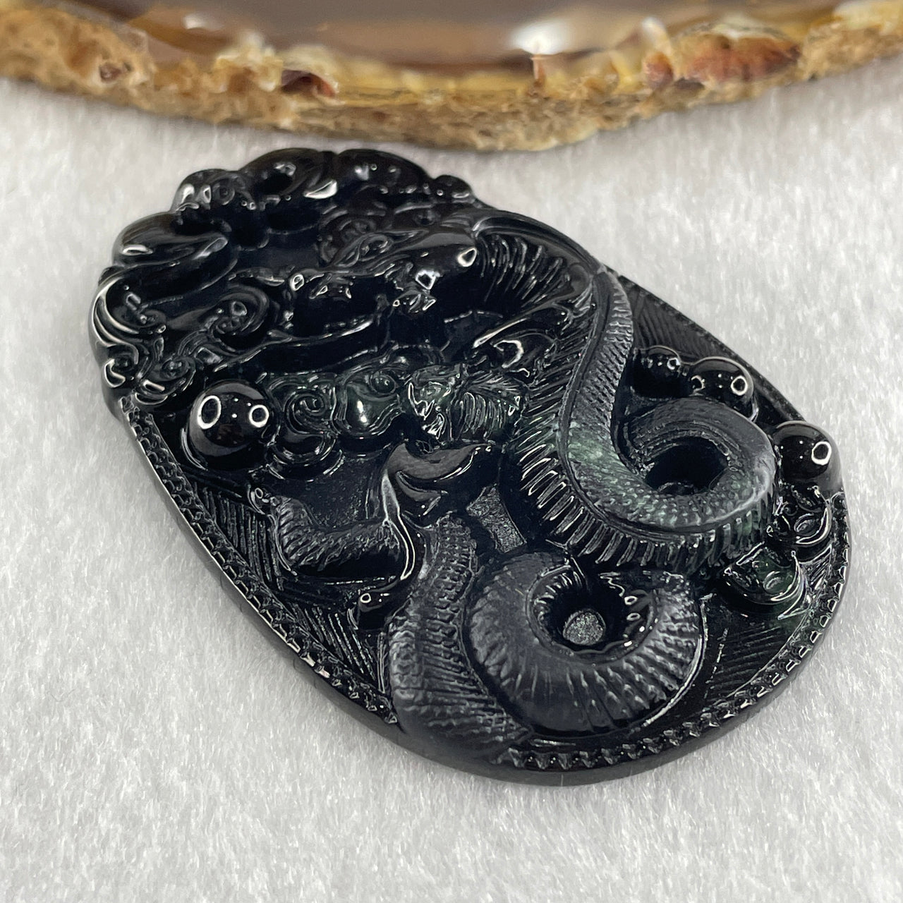 Type A Opaque to Partial Translucent Black Omphacite Jadeite Snake Pendant 24.70g 59.7 by 40.1 by 8.5mm - Huangs Jadeite and Jewelry Pte Ltd