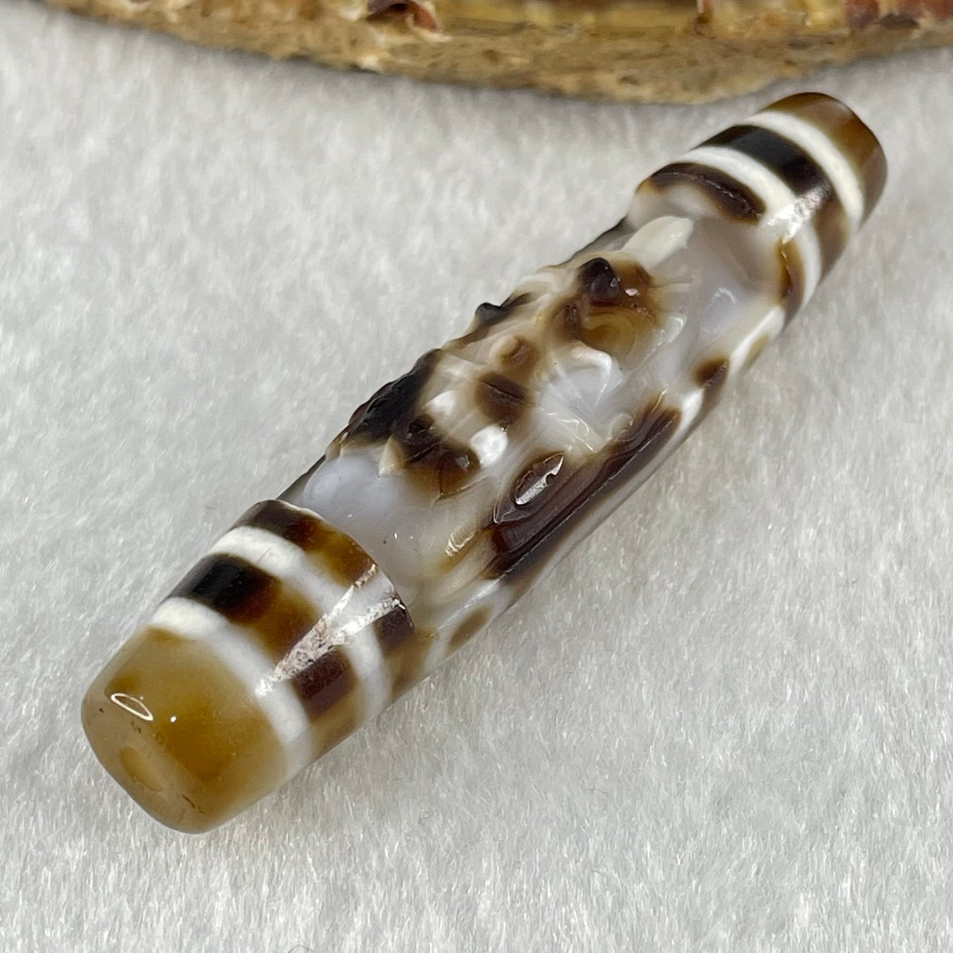 Natural Powerful Tibetan Old Oily Agate Zha Ji La Mu Female Cai Shen Carvings on 9 Eyes Dzi Bead Heavenly Master (Tian Zhu) 九眼扎基拉姆女财神天珠 13.88g 57.4 by 13.3mm - Huangs Jadeite and Jewelry Pte Ltd