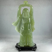 Natural Green Serpentine Stand Laughing Milo Buddha with Wealth Pot with Wooden Stand Display 1,599.3g 140.0 by 90.0 by 270.0mm - Huangs Jadeite and Jewelry Pte Ltd