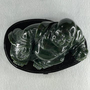Natural Dark Green Serpentine Laughing Milo Buddha with Wealth Pot with Wooden Stand Display 1,656.6g 190.0 by 133.0 by 127.0mm - Huangs Jadeite and Jewelry Pte Ltd