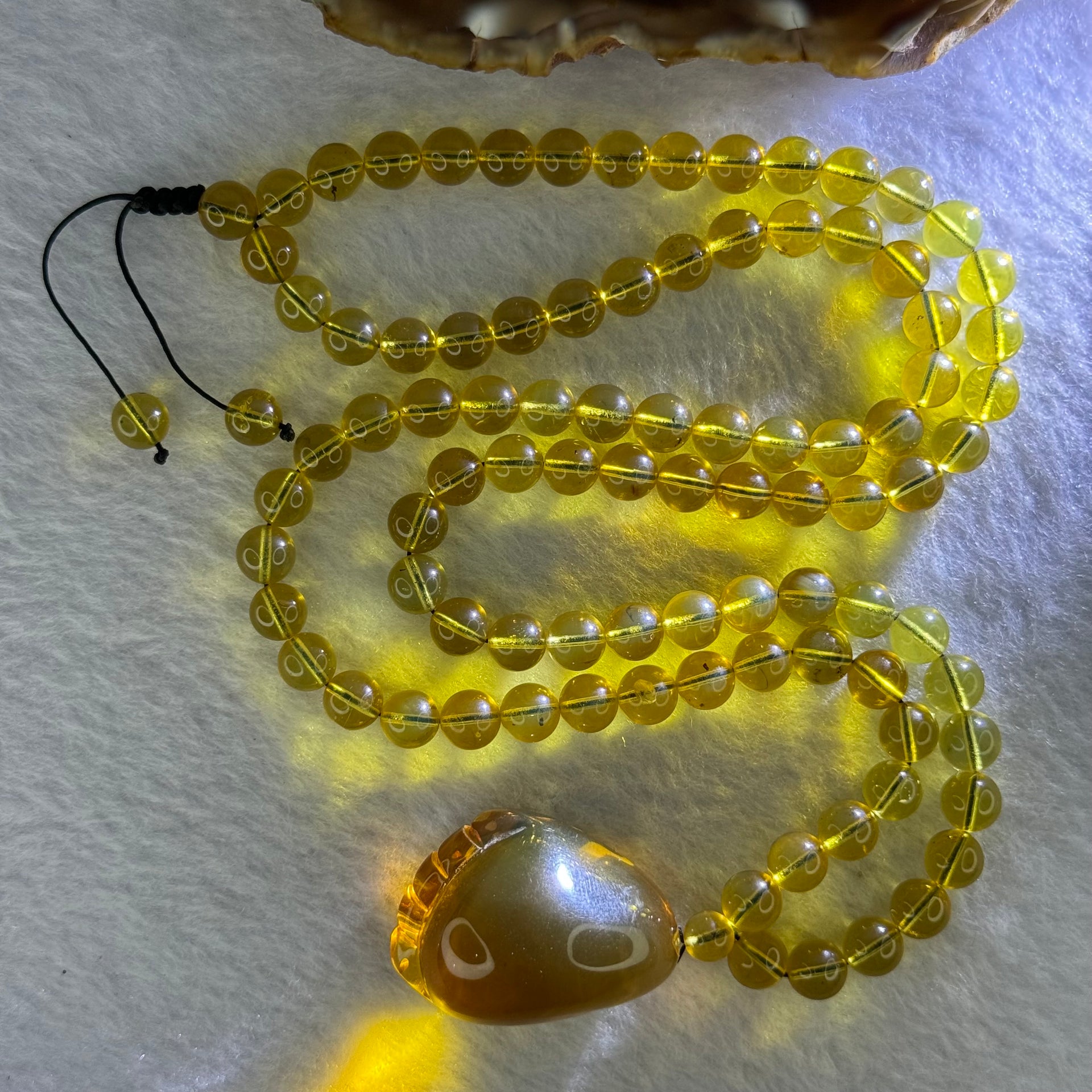 Natural Yellow Amber Foot Pendent 32.5 by 24.2 by 19.5mm with Yellow Amber Beads Necklace 6.9mm 104 Beads Total 22.56g - Huangs Jadeite and Jewelry Pte Ltd