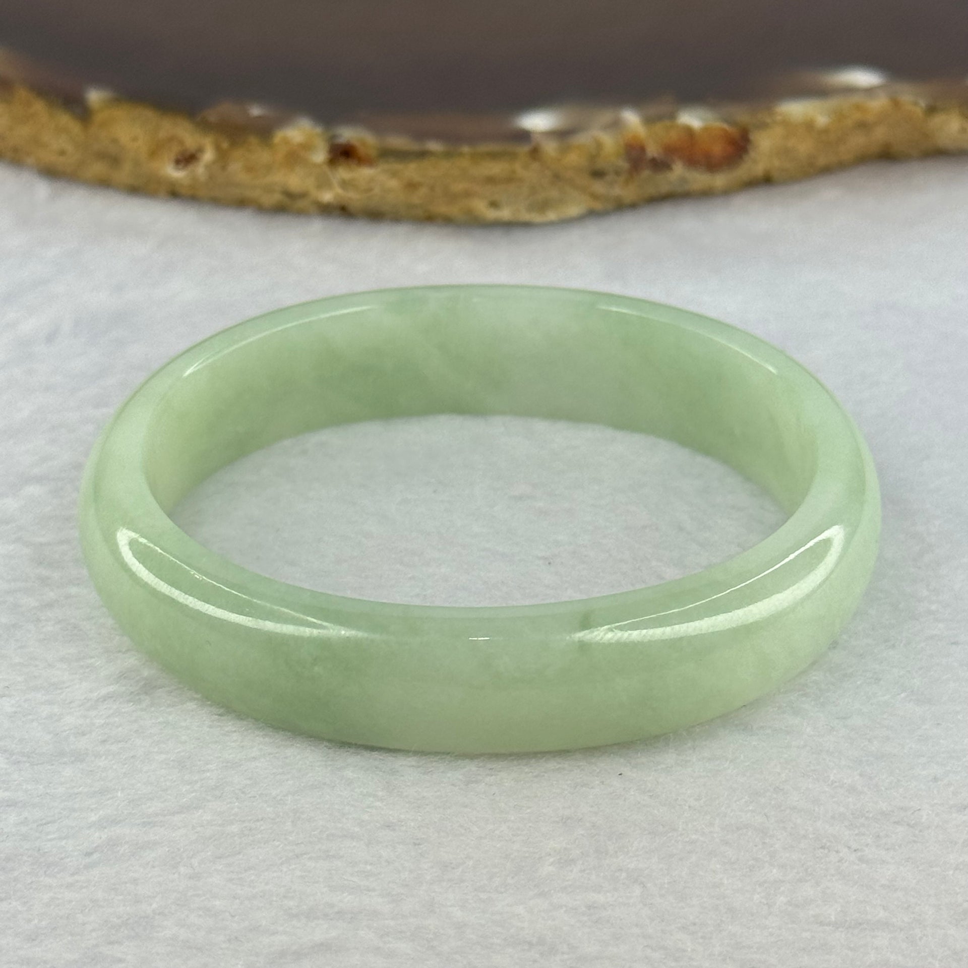 Type A Light Apple Green Jadeite Oval Bangle 33.35g Internal Diameter 52.3mm 12.2 by 6.5mm (Very Slight Fine Internal Lines) - Huangs Jadeite and Jewelry Pte Ltd