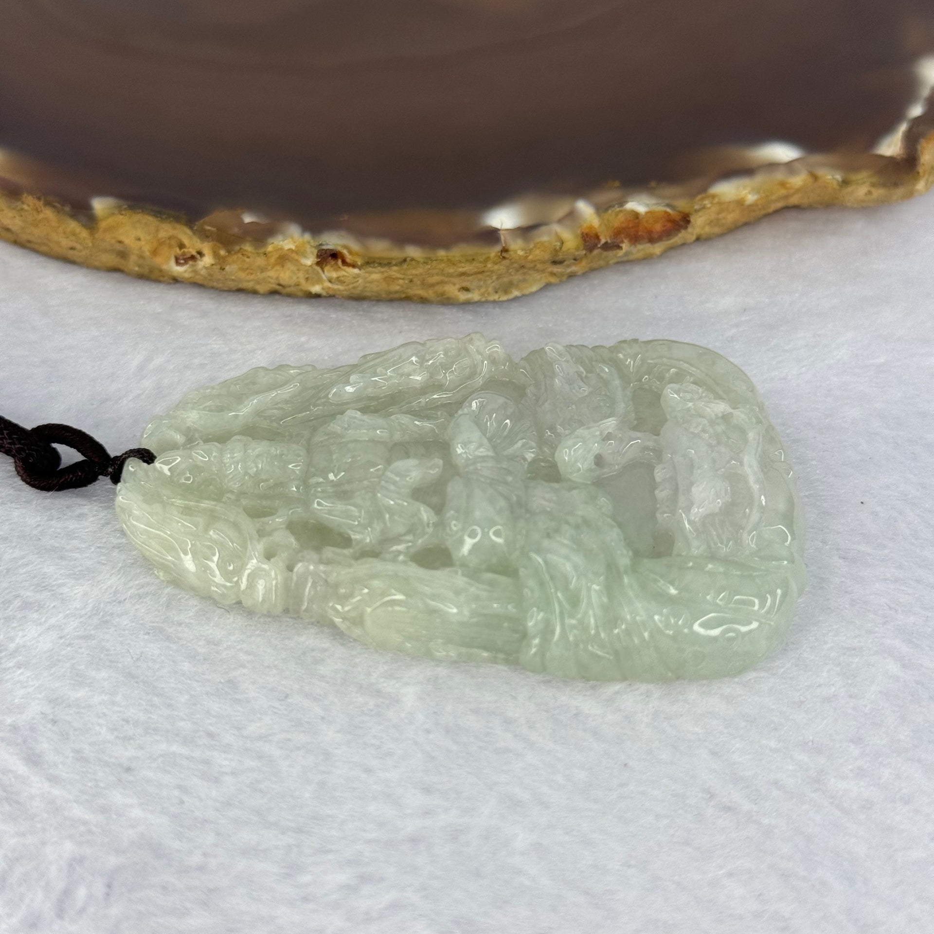 Type A Light Green Lavender Jadeite Guan Yin with 9 Dragons Pendent 51.21g 65.5 by 41.3 by 10.3mm - Huangs Jadeite and Jewelry Pte Ltd