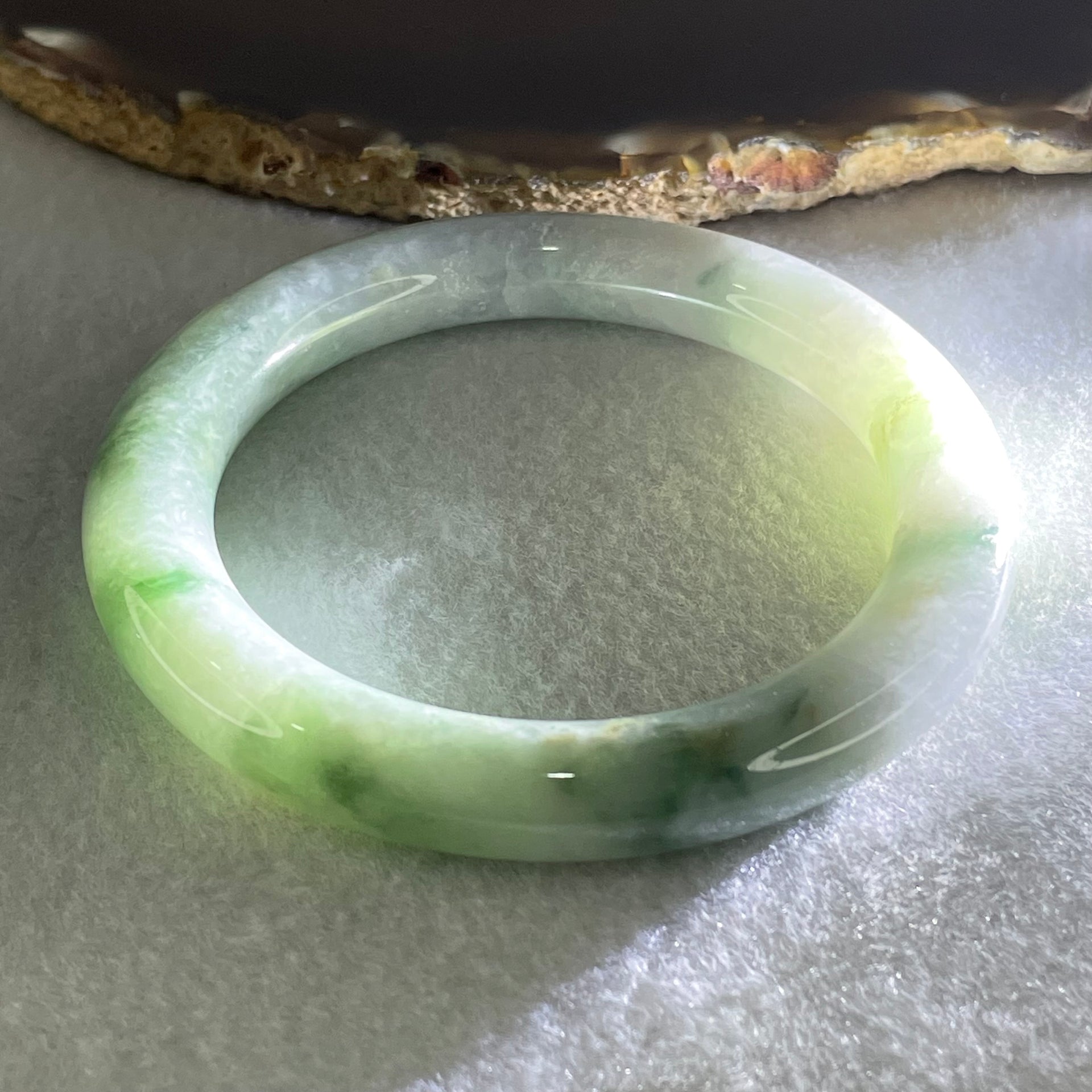 Type A Light Green with Green piao Hua Floral Jadeite Bangle 54.80g Inner Diameter 55.9mm 10.2 by 10.6mm (Internal Lines) - Huangs Jadeite and Jewelry Pte Ltd