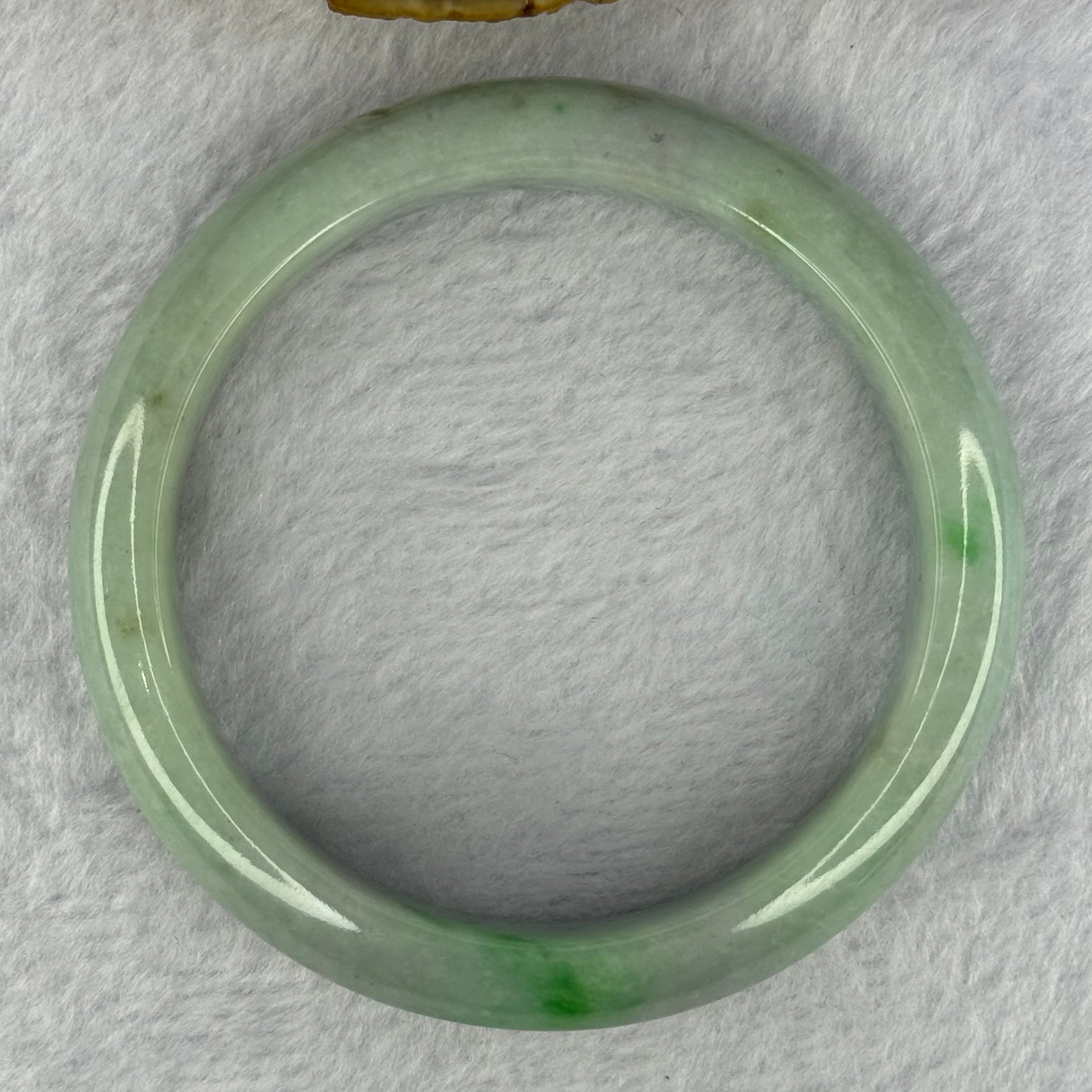 Type A Light Green with Bright Green Patches Jadeite Bangle 78.00g Internal Diameter 61.7mm 14.5 by 9.9mm (Very Slight External Rough) - Huangs Jadeite and Jewelry Pte Ltd