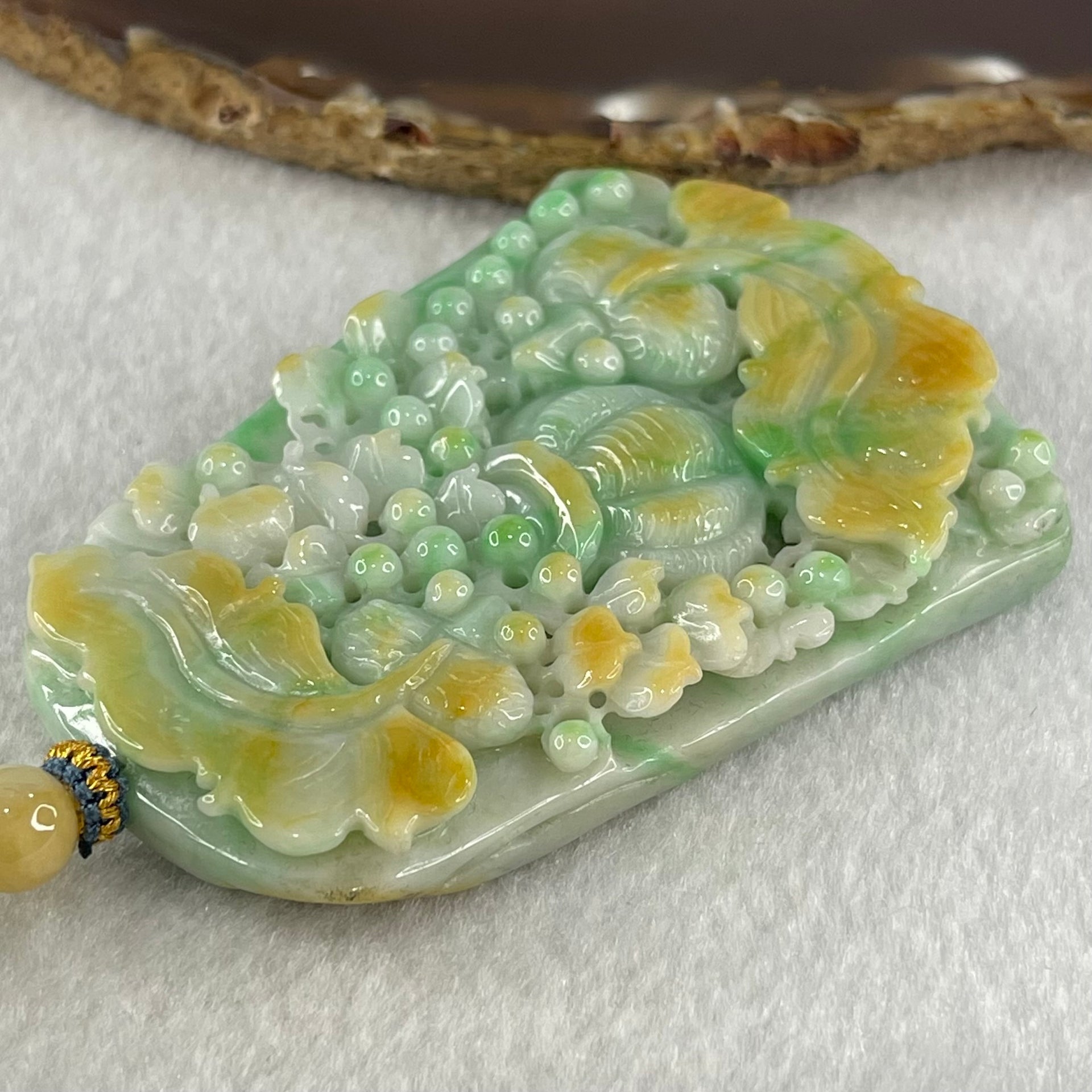 Grand Master Type A Green with Yellow Patches Jadeite Goldfish Pair and Basket of Flowers Pendant 连年有余 109.37g 76.2 by 53.5 by 12.3mm - Huangs Jadeite and Jewelry Pte Ltd