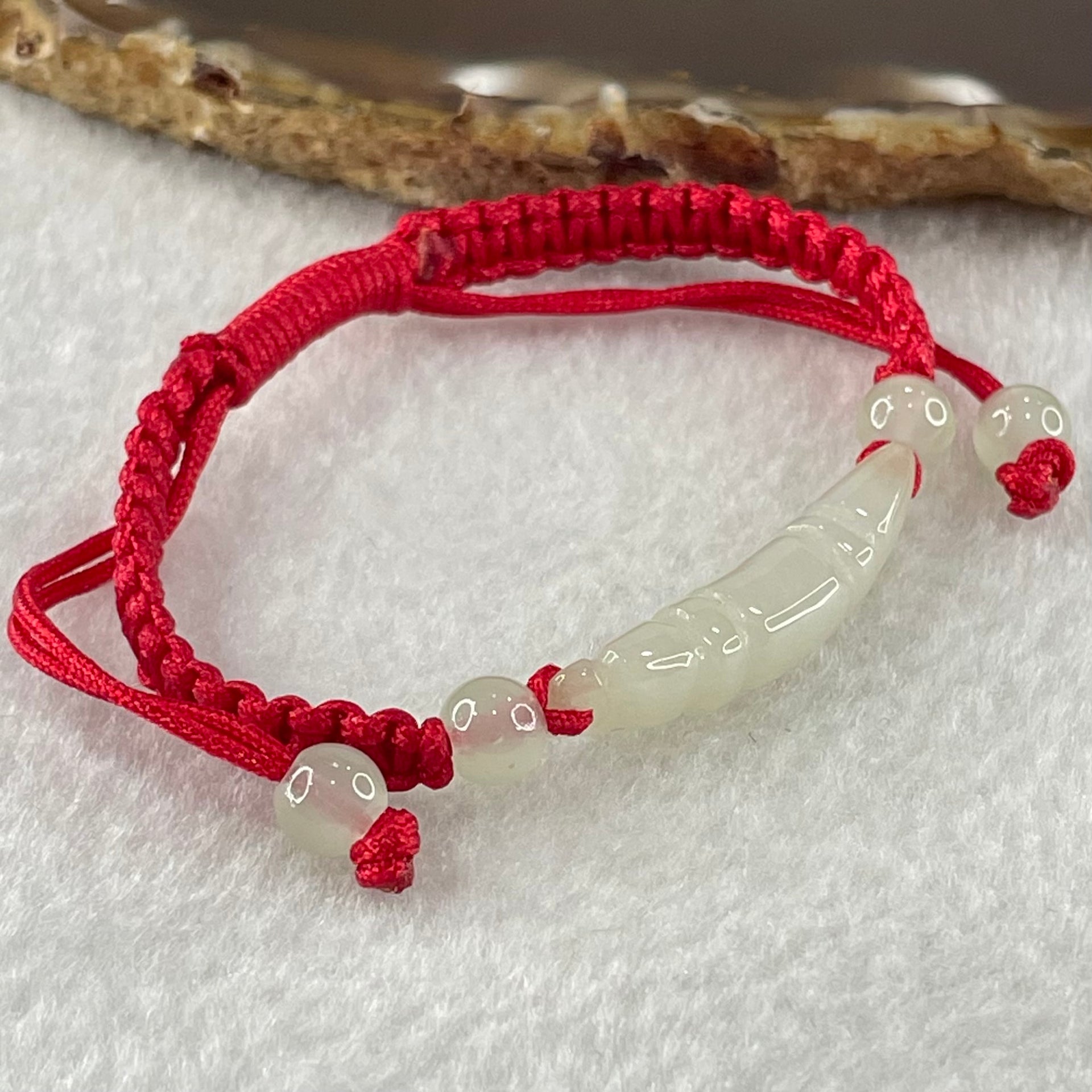 Type A Light Green Jadeite Scholarship Brush in Red String Bracelet 5.57g 6.7 by 7.5 by 33.5mm - Huangs Jadeite and Jewelry Pte Ltd