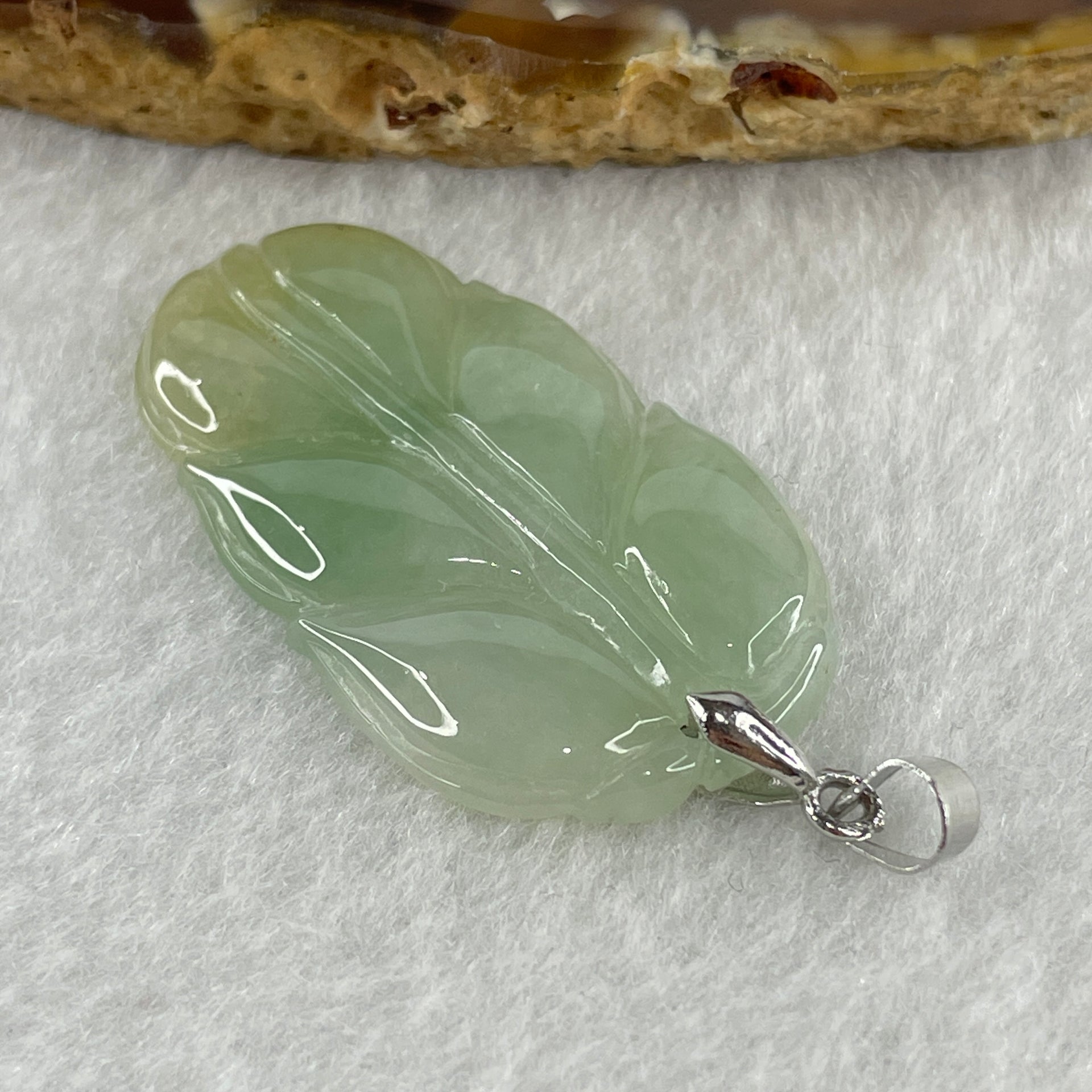 Natural Type A Semi Icy Light Green with Light Yellow Jadeite Prosperity Leaf Pendant in Silver Clasp Signifying Overnight Success 6.55g 38.4 by 21.6 by 4.0mm - Huangs Jadeite and Jewelry Pte Ltd