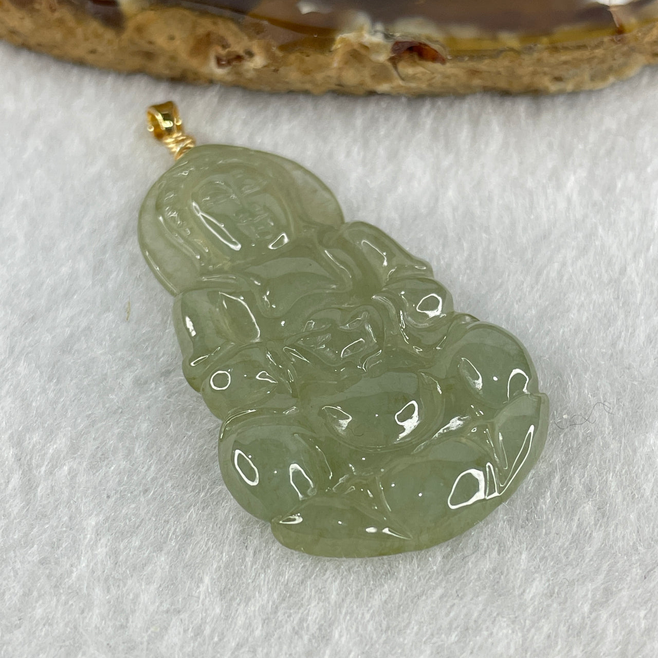 Natural Type A Icy Light Green Jadeite Guan Yin Pendant in Gold Color Stainless Steel Clasp 9.16g 43.5 by 26.0 by 4.9mm - Huangs Jadeite and Jewelry Pte Ltd