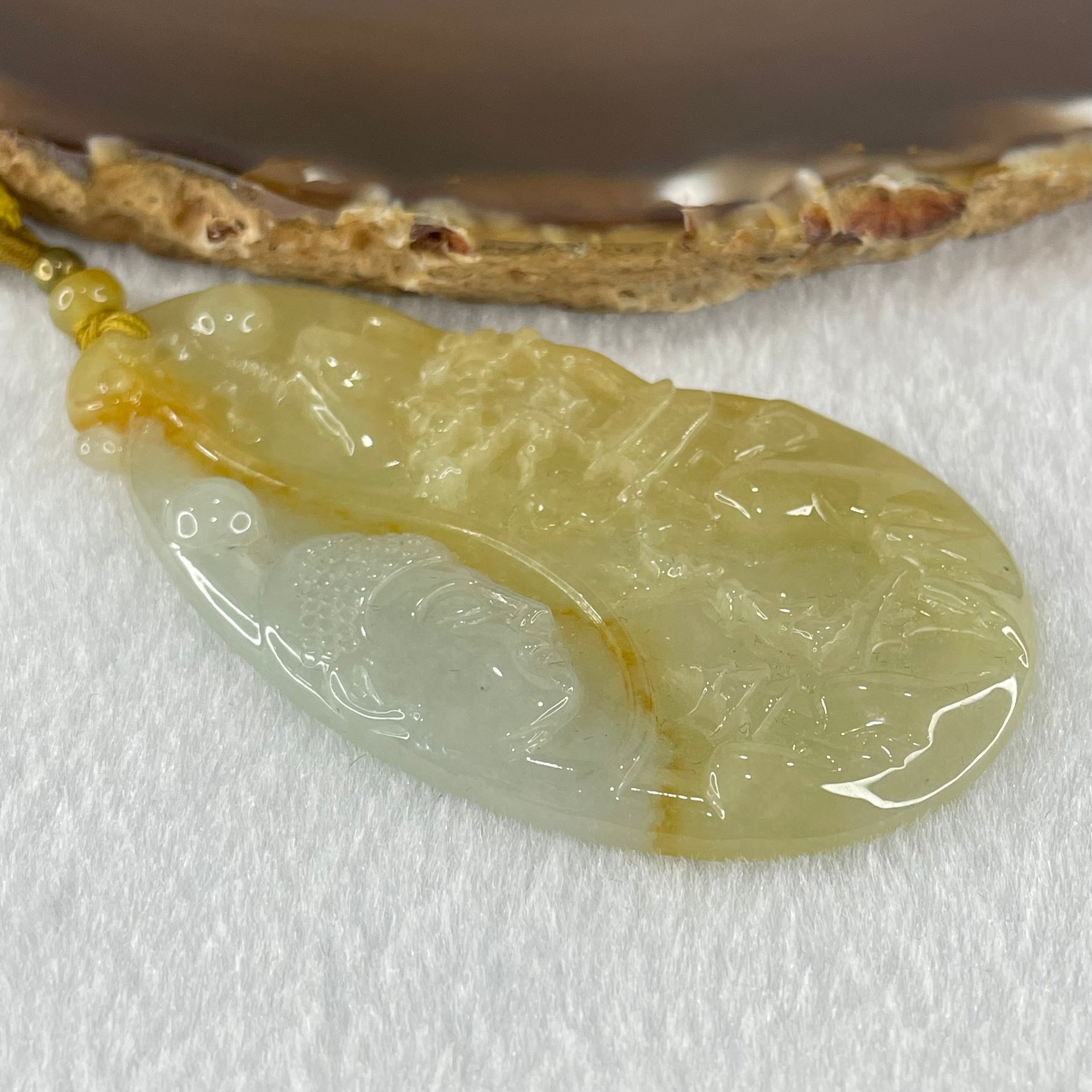 Grandmaster Type A Yellow with Faint Green and Red Jadeite Shan Shui with Buddha Pendant 22.54g 69.8 by 39.7 by 4.8mm - Huangs Jadeite and Jewelry Pte Ltd