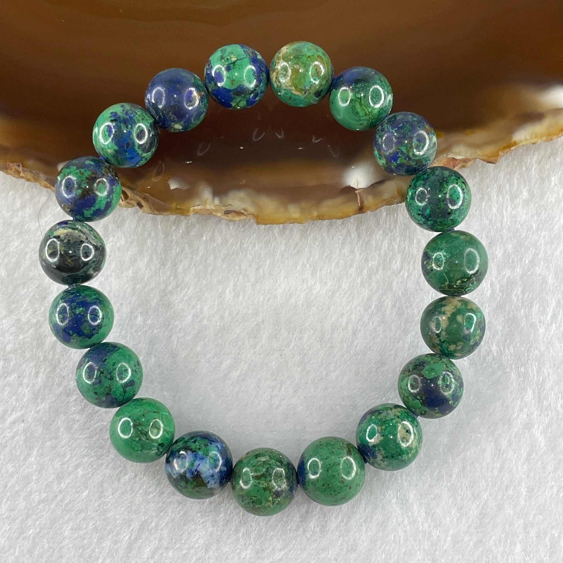 Natural azurite beaded bracelet with 19 round blue-green stones on an elastic band