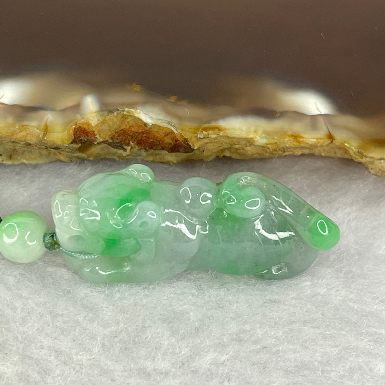 Type A Spicy Green with Wuji Grey Jadeite Tiger 8.34g by 29.3 by 9.5 by 11.9mm - Huangs Jadeite and Jewelry Pte Ltd