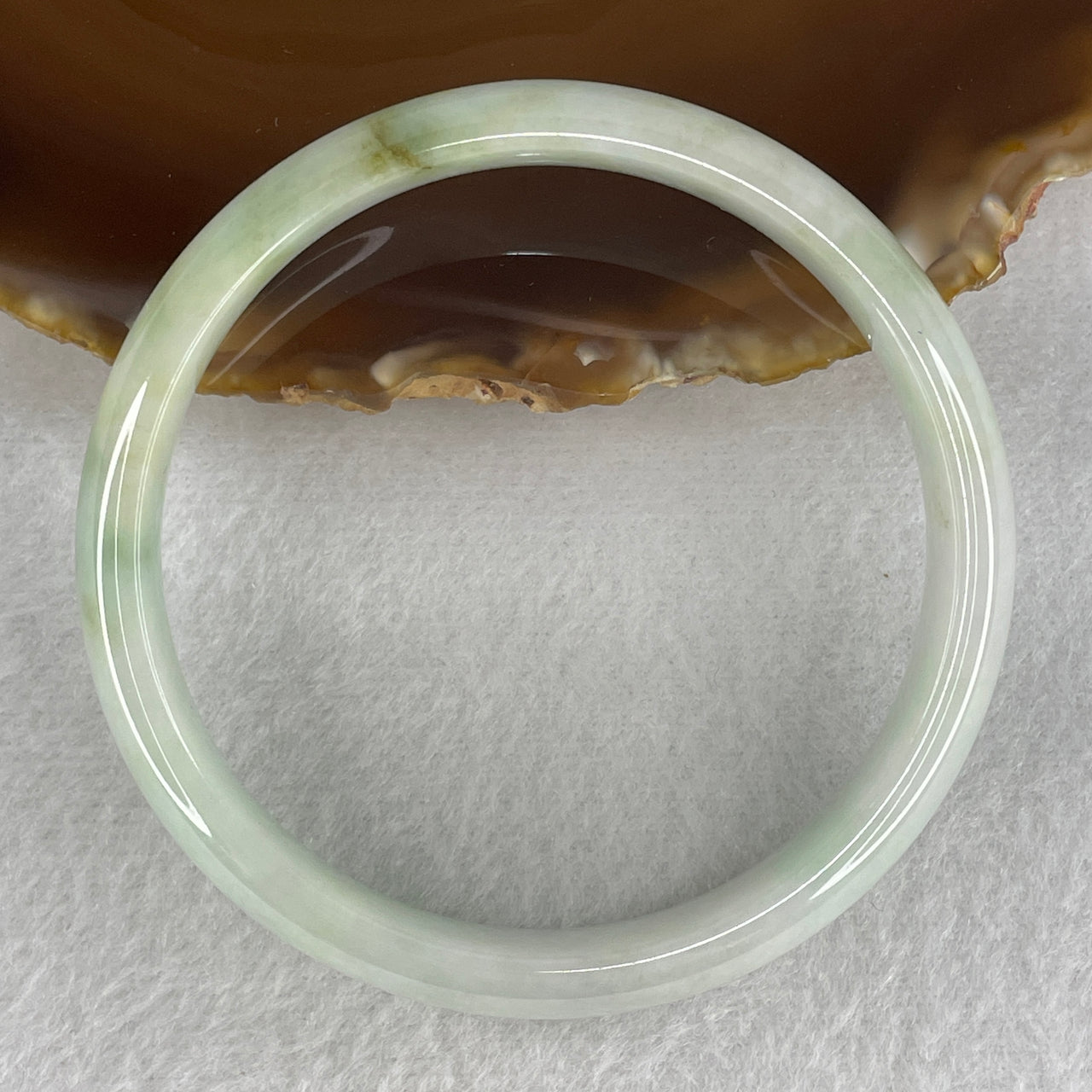 Natural Type A Jadeite Bangle – Light Green with Yellowish Piao Hua | Symbol of Wealth, Harmony & Abundance 40.65g Inner Diameter 59.9mm 11.5 by 7.3mm (Slight Internal Lines)