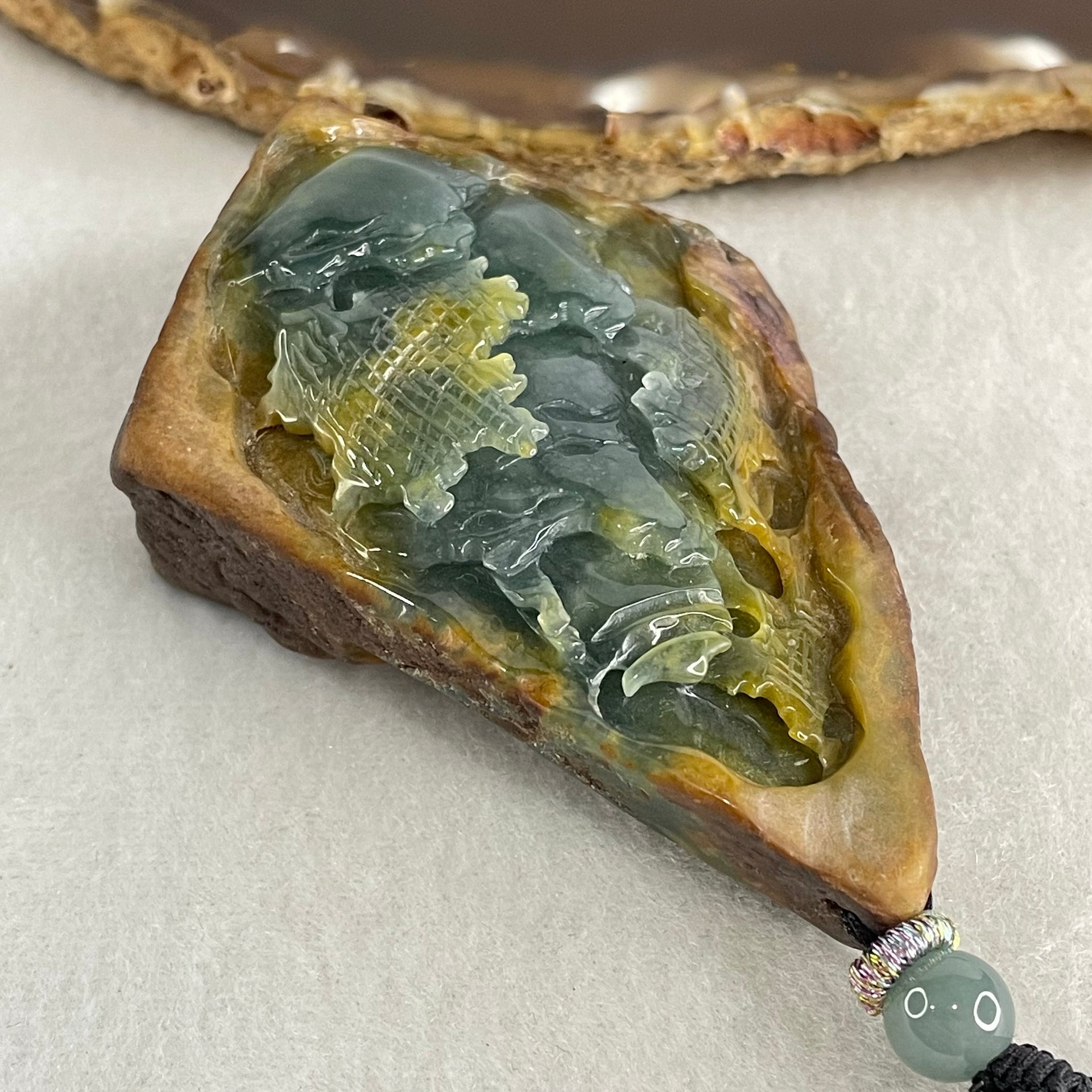 Grand Master Type A Brown with Blueish Green Jadeite Shan Shui with Guiren Benefactor Pendant 107.48g 74.0 by 53.9 by 23.3mm - Huangs Jadeite and Jewelry Pte Ltd