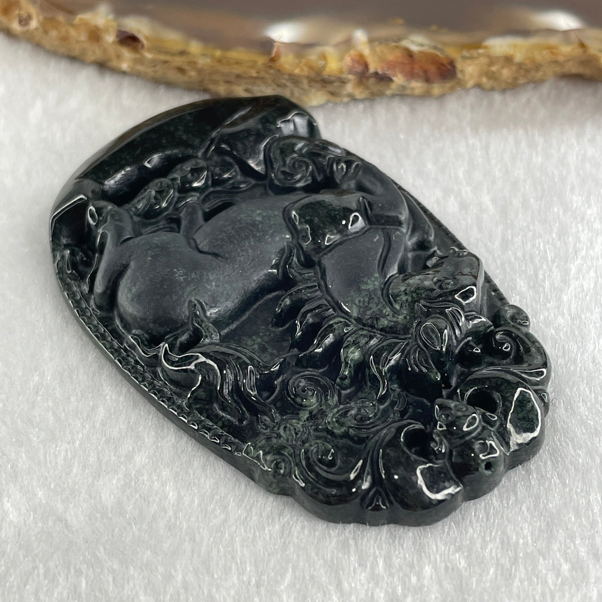 Type A Opaque to Partial Translucent Black Omphacite Jadeite Horse Pendant 26.34g 60.1 by 40.3 by 8.0mm - Huangs Jadeite and Jewelry Pte Ltd