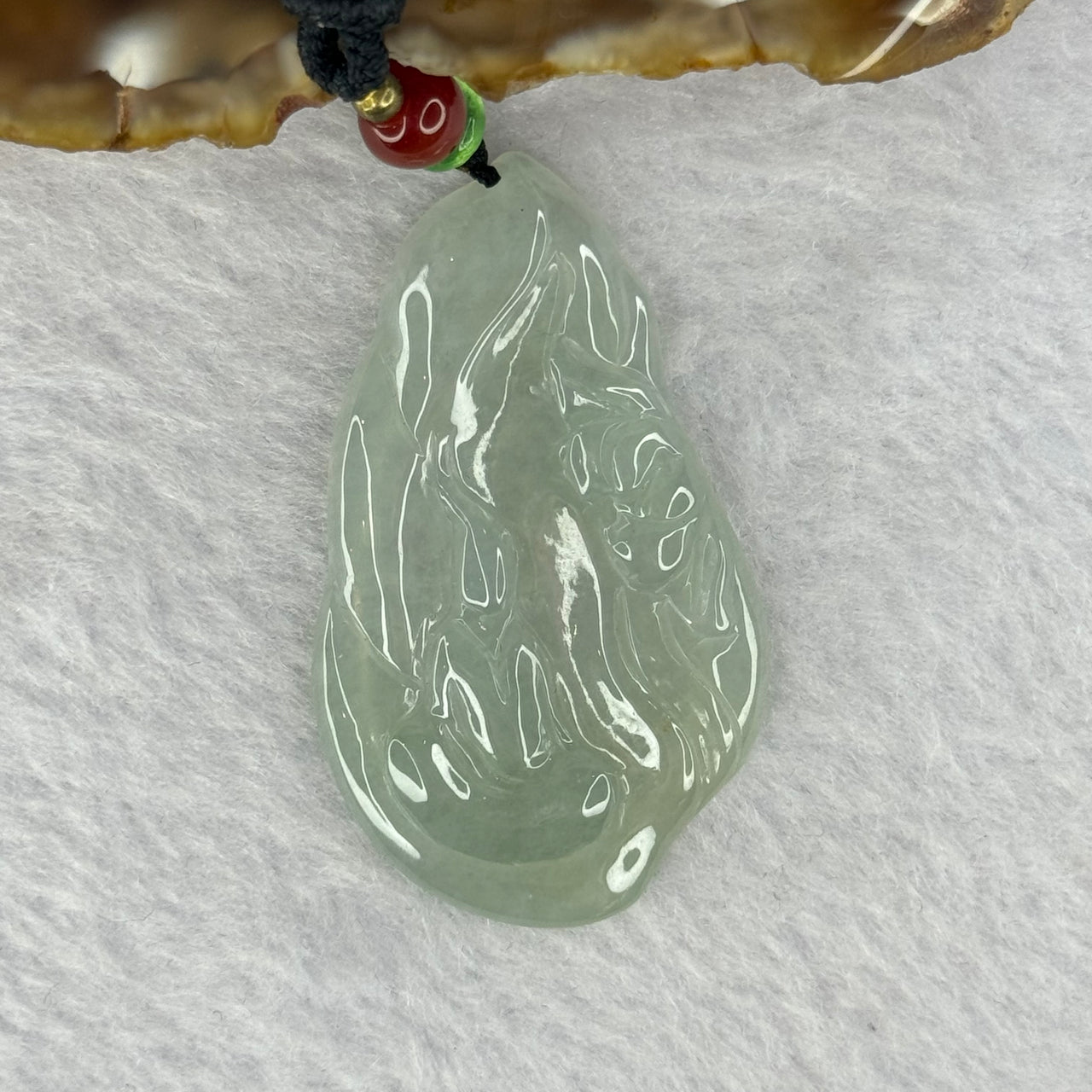 Type A Semi ICY Light Green Jadeite Benefactor with Lotus Flower Pendent 12.08g 46.4 by 27.6 by 4.8mm - Huangs Jadeite and Jewelry Pte Ltd