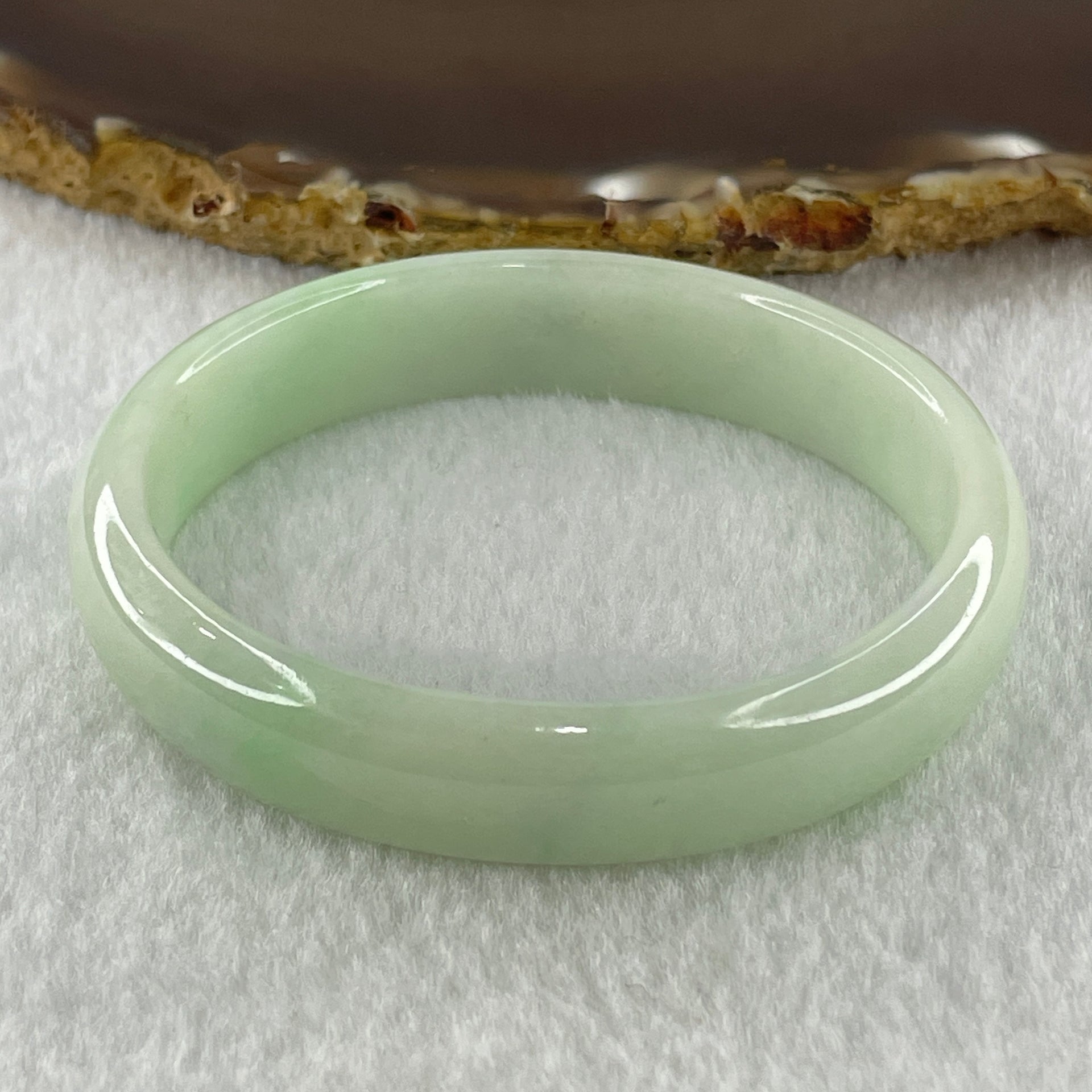 Natural Type A Light Green Jadeite Oval Bangle 36.17g Inner Diameter 54.6mm 12.5 by 6.4mm (Internal Lines) - Huangs Jadeite and Jewelry Pte Ltd