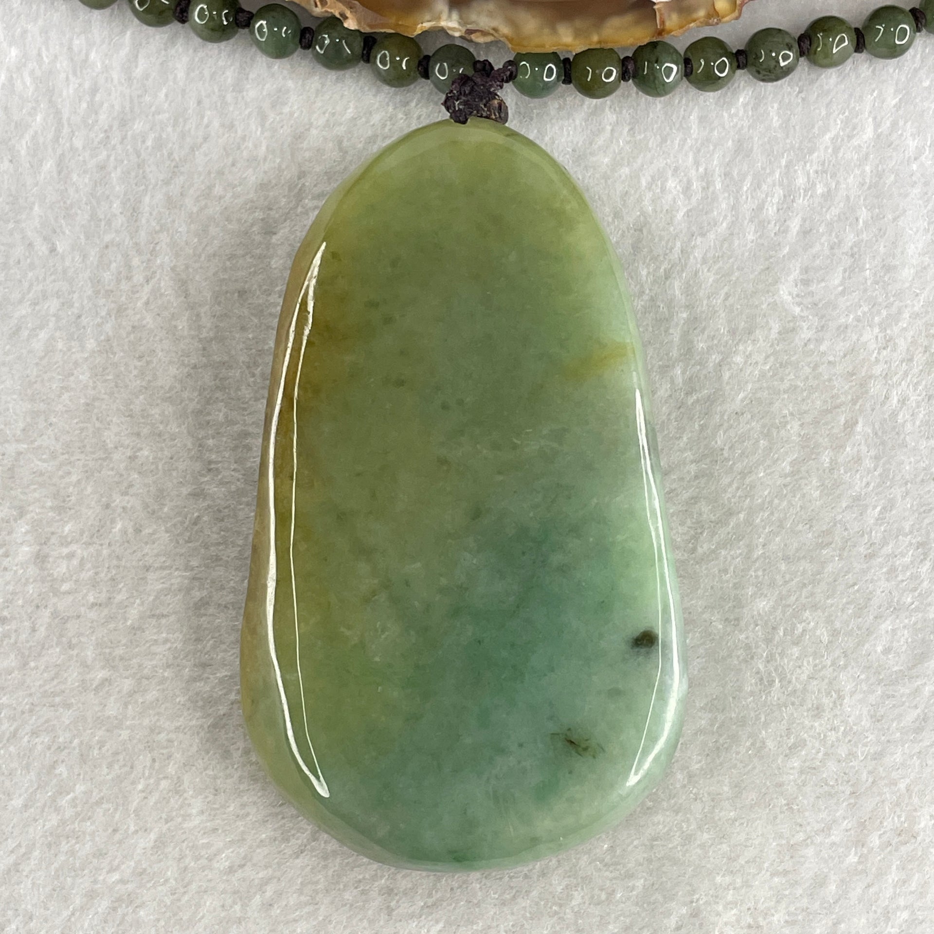 Natural Type A Green with Yellowish Jadeite Shan Shui with Gui Ren Pendant 127.68g 75.0 by 44.7 by 14.7mm - Huangs Jadeite and Jewelry Pte Ltd