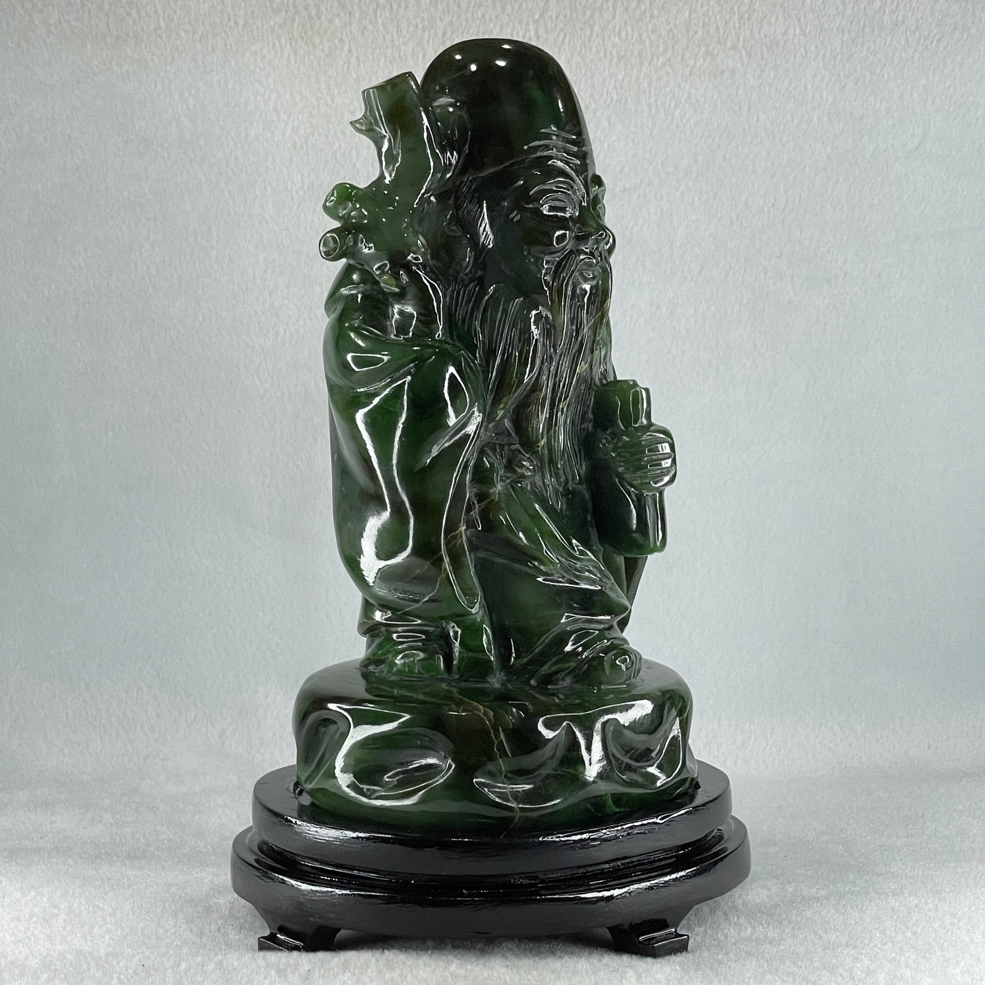 Natural Dark Green Serpentine Shou Xing Gong with Wooden Stand Display 2,374.7g 140.0 by 228.0 by 125.0mm - Huangs Jadeite and Jewelry Pte Ltd