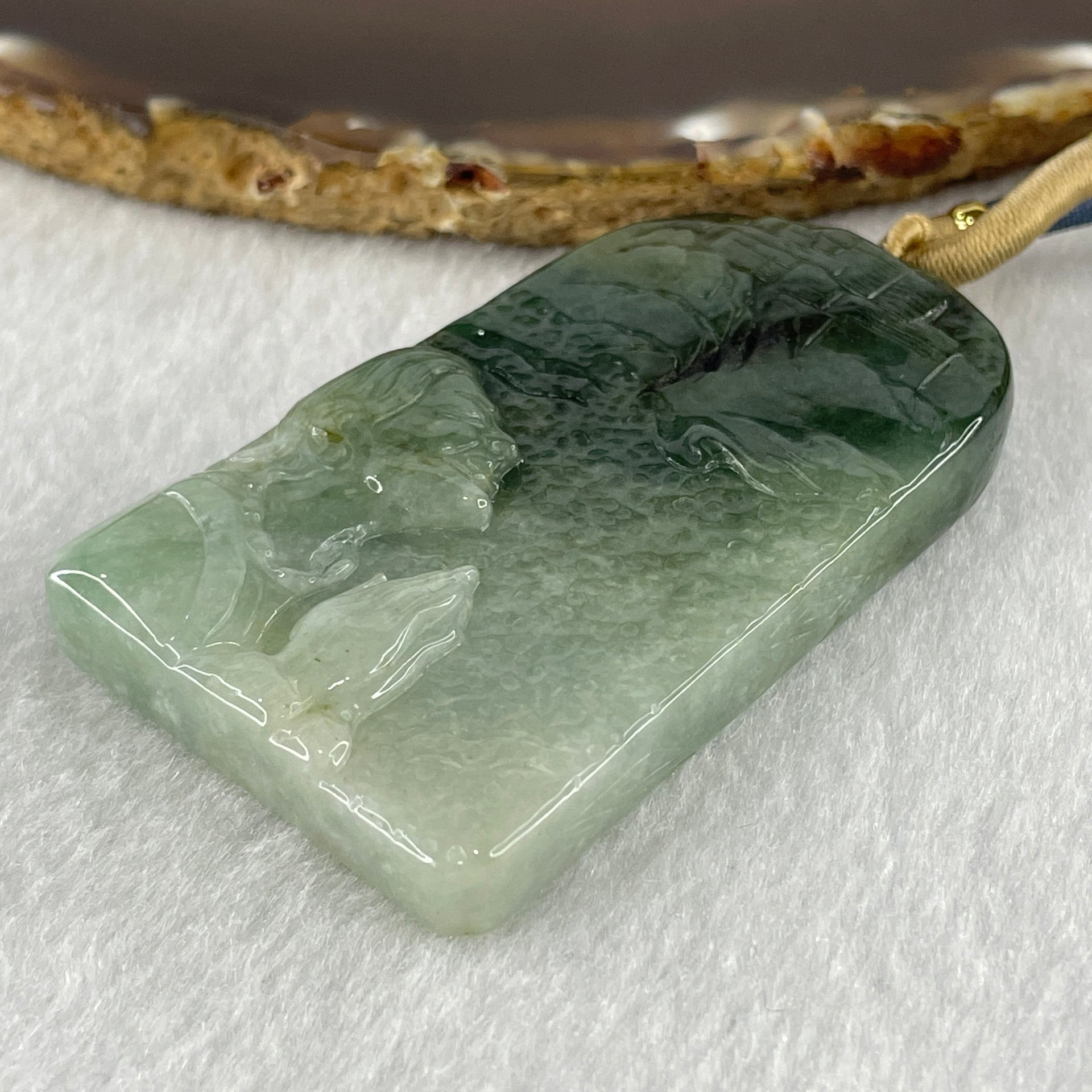 Natural Type A Light Green to Dark Green Jadeite People Seeking for Enlightenment Pendant 66.767g 64.1 by 39.0 by 11.0mm - Huangs Jadeite and Jewelry Pte Ltd