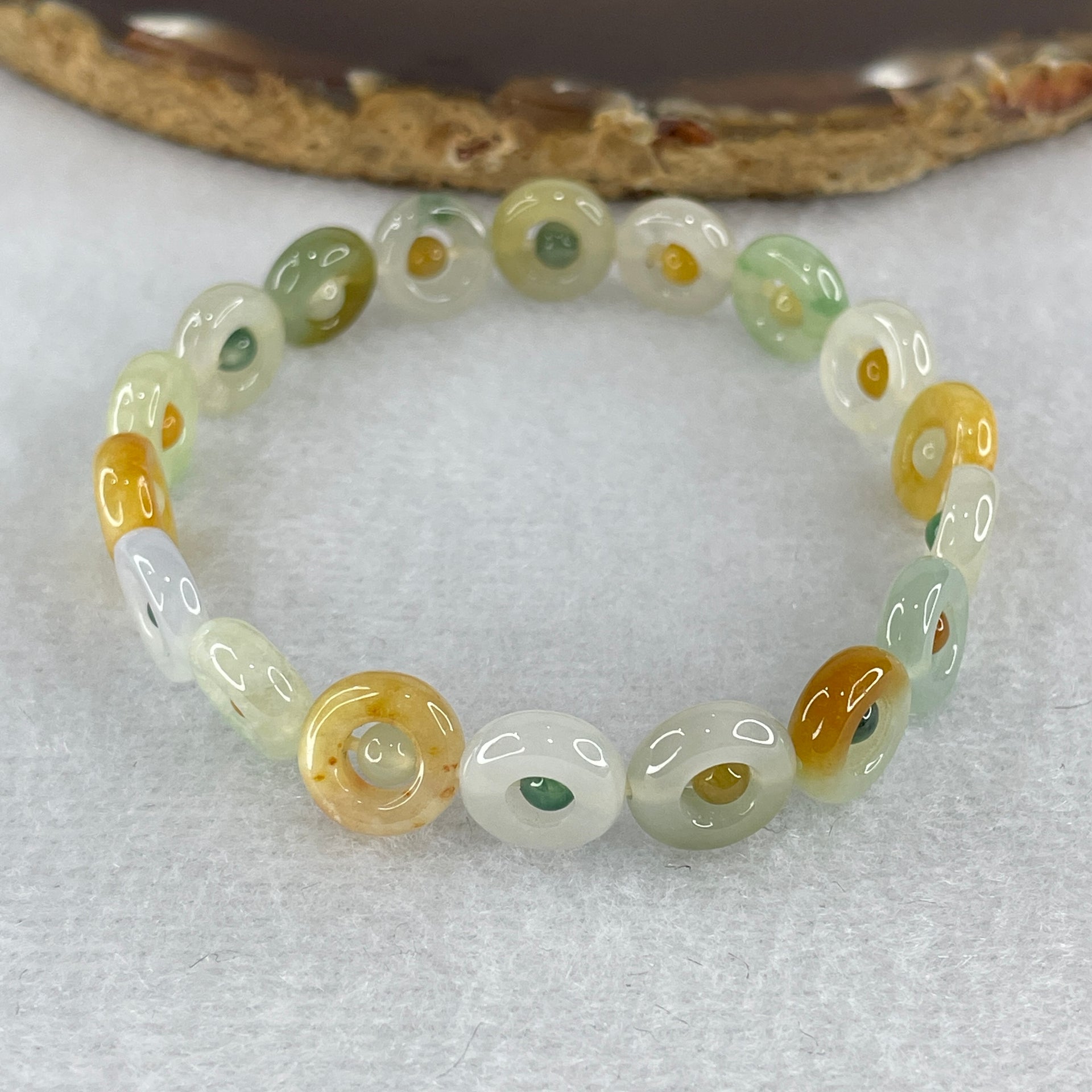 Natural Type A Muti Green with Lavender Yellowish Jadeite Donut Bracelet 12.17g 15.5cm 9.9 by 3.2mm 18 Ping An Kow - Huangs Jadeite and Jewelry Pte Ltd