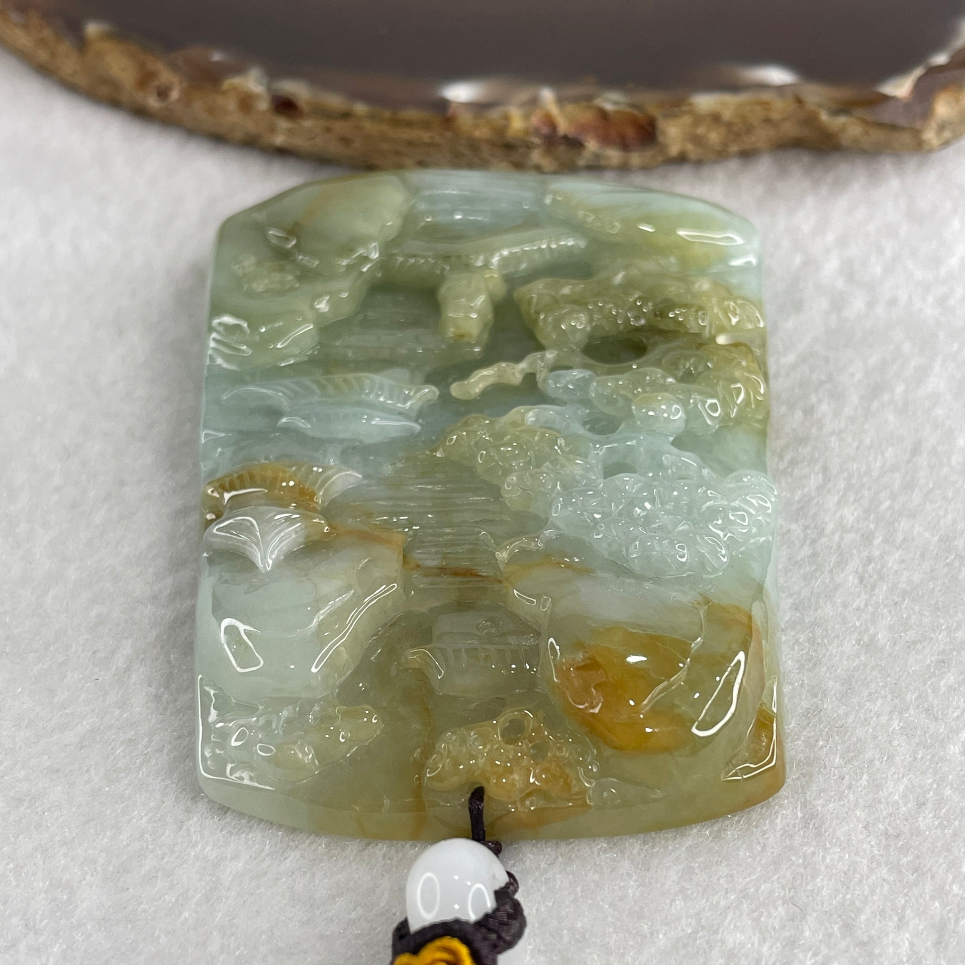 Natural Type A Sky Blue with Yellowish Green Jadeite Shan Shui with Gui Ren Benefactor Pendant 94.26g 75.5 by 55.5 by 10.5mm - Huangs Jadeite and Jewelry Pte Ltd