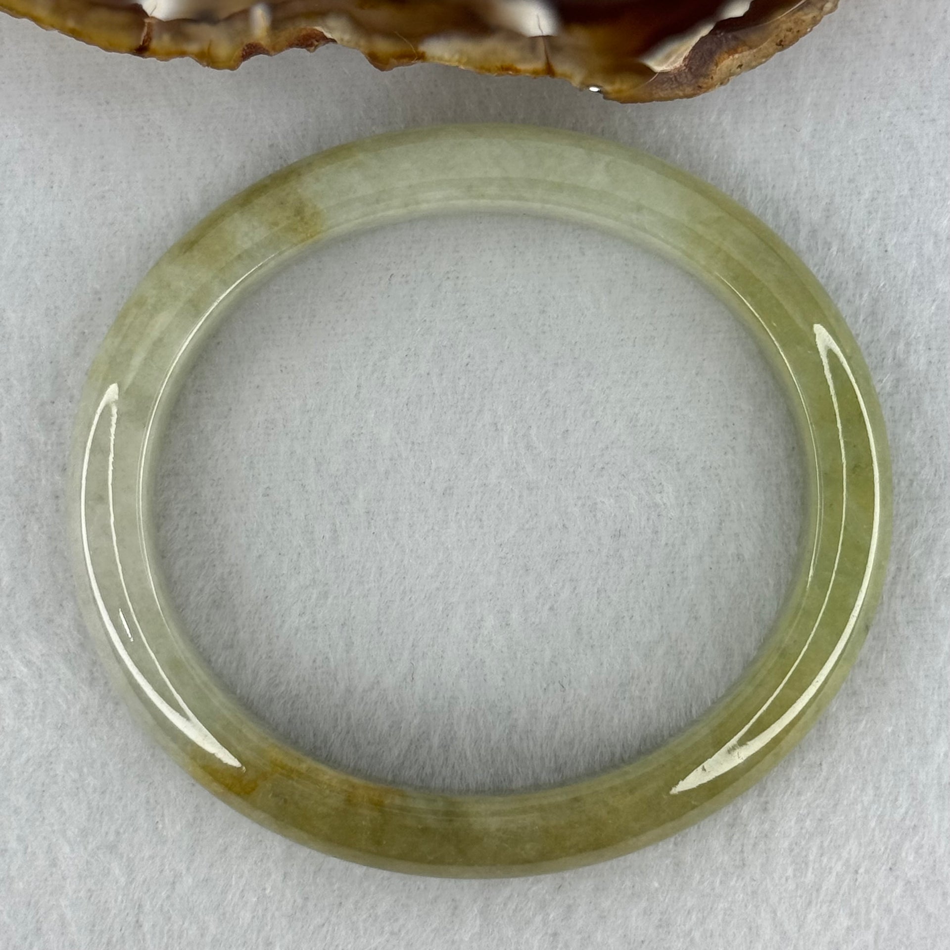 Type A Yellowish Green Lavender Jadeite Oval Bangle Internal Diameter 58.5mm 67.31g 10.7 by 8.1mm (Very Slight Fine Internal Line) - Huangs Jadeite and Jewelry Pte Ltd
