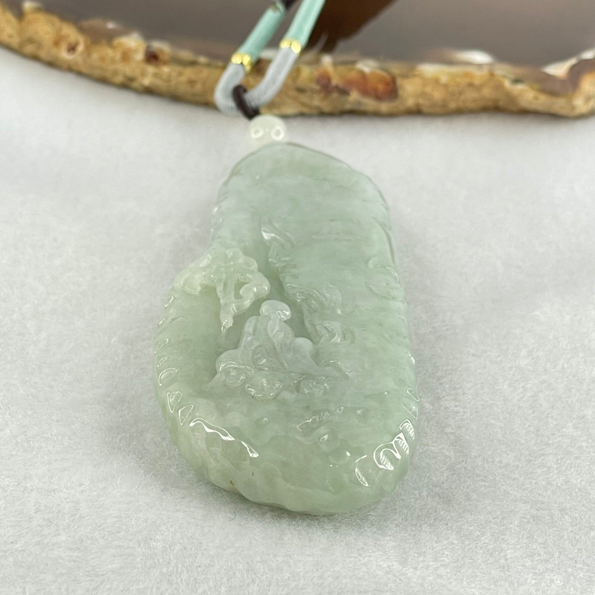 Type A Light Blueish Green Jadeite Seeking Enlightenment with Buddha Pendant 68.18g 78.6 by 32.5 by 12.5mm - Huangs Jadeite and Jewelry Pte Ltd