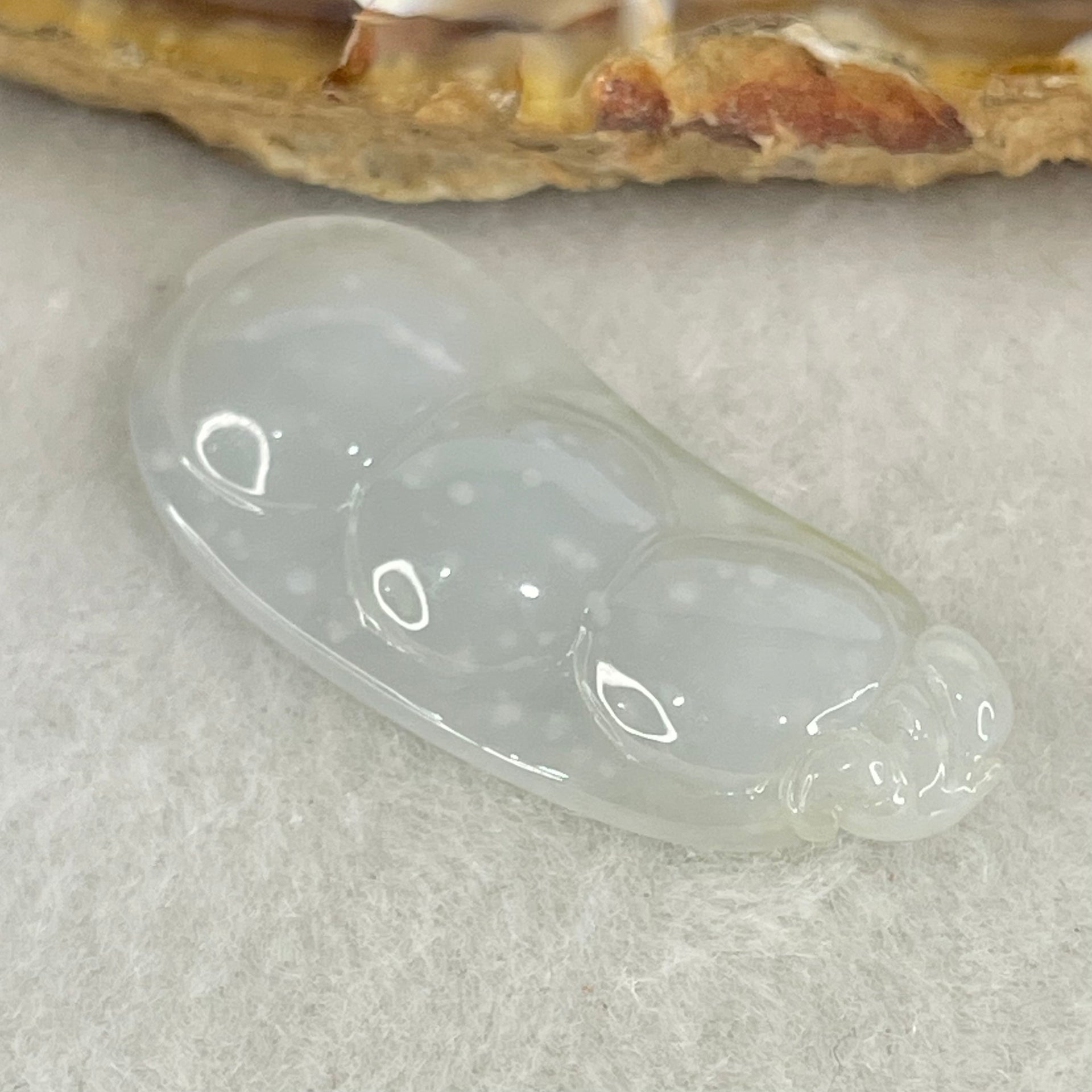 Type A Semi Icy Faint Green with Muna Jadeite Peapod Pendant 5.34g 35.5 by 15.5 by 5.9mm - Huangs Jadeite and Jewelry Pte Ltd