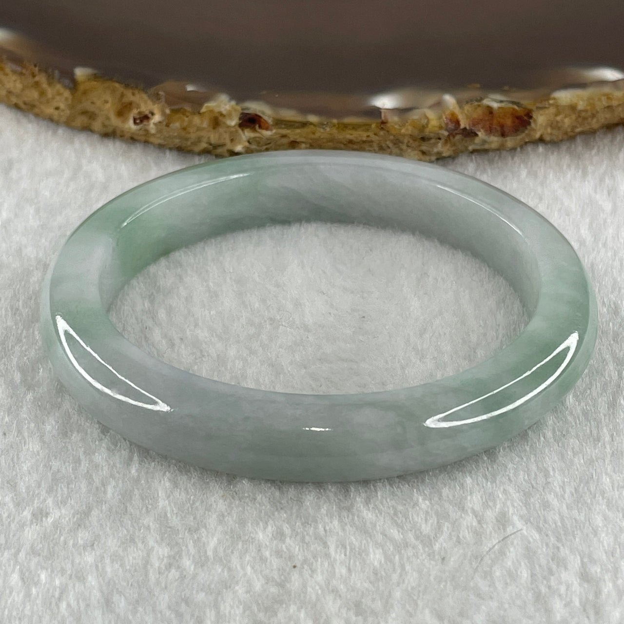 Type A Natural Light Green Jadeite Oval Bangle 34.44g Inner Diameter 52.2mm 9.2 by 8.0mm (Internal Lines) - Huangs Jadeite and Jewelry Pte Ltd