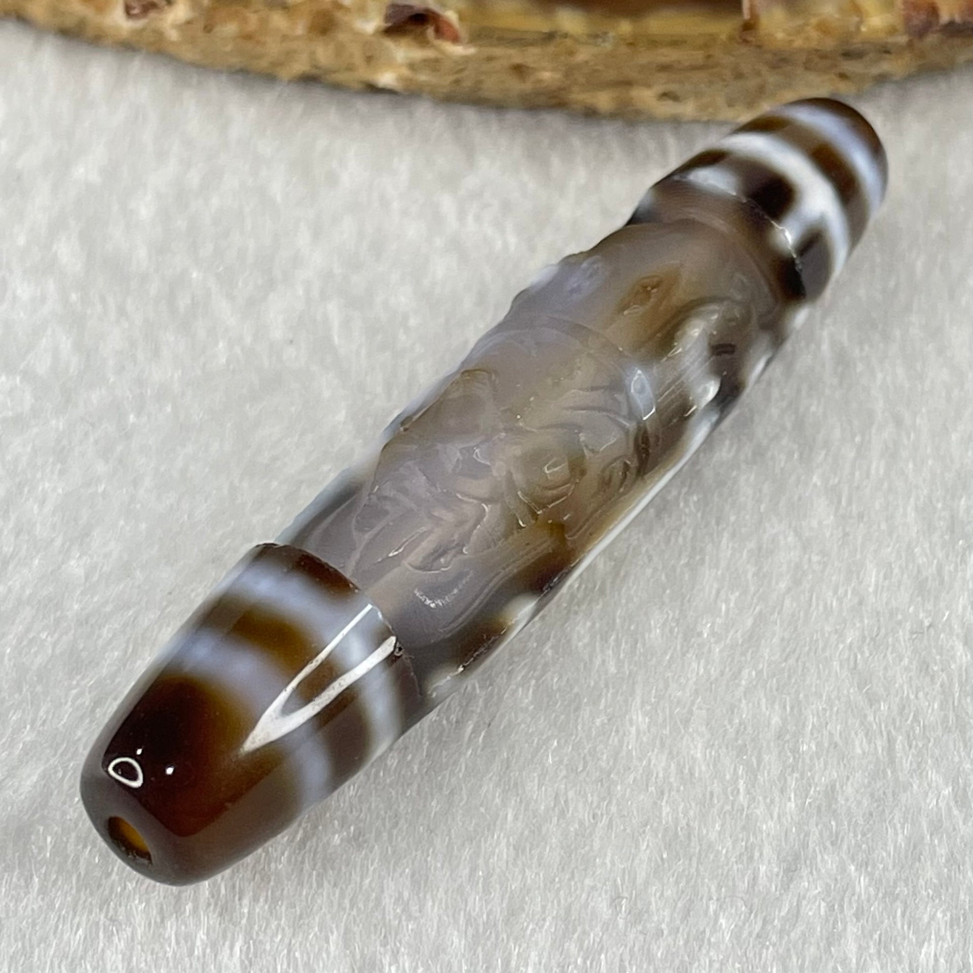 Natural Powerful Tibetan Old Oily Agate Zha Ji La Mu Female Cai Shen Carvings on 9 Eyes Dzi Bead Heavenly Master (Tian Zhu) 九眼扎基拉姆女财神天珠 11.04g 57.9 by 12.0mm - Huangs Jadeite and Jewelry Pte Ltd