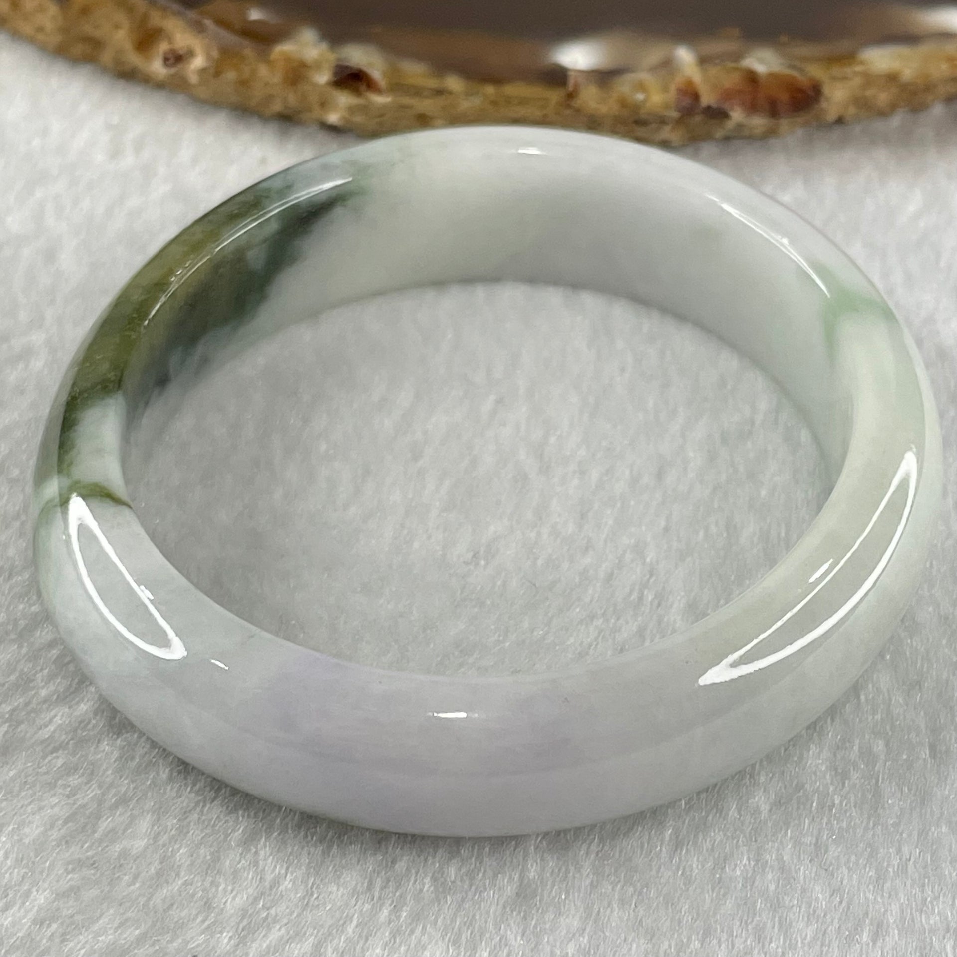 Type A Faint Lavender with Moss Green Patches Jadeite Oval Bangle 43.11g Internal Diameter 53.3mm 13.5 by 6.9mm (Slight External Roughs and Internal Lines) - Huangs Jadeite and Jewelry Pte Ltd