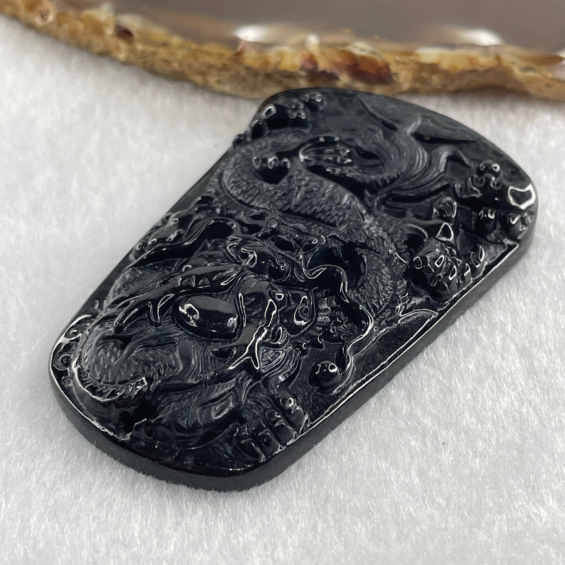 Type A Opaque to Partial Translucent Black Omphacite Jadeite Dragon Pendant 32.91g 66.0 by 42.2 by 9.5mm - Huangs Jadeite and Jewelry Pte Ltd